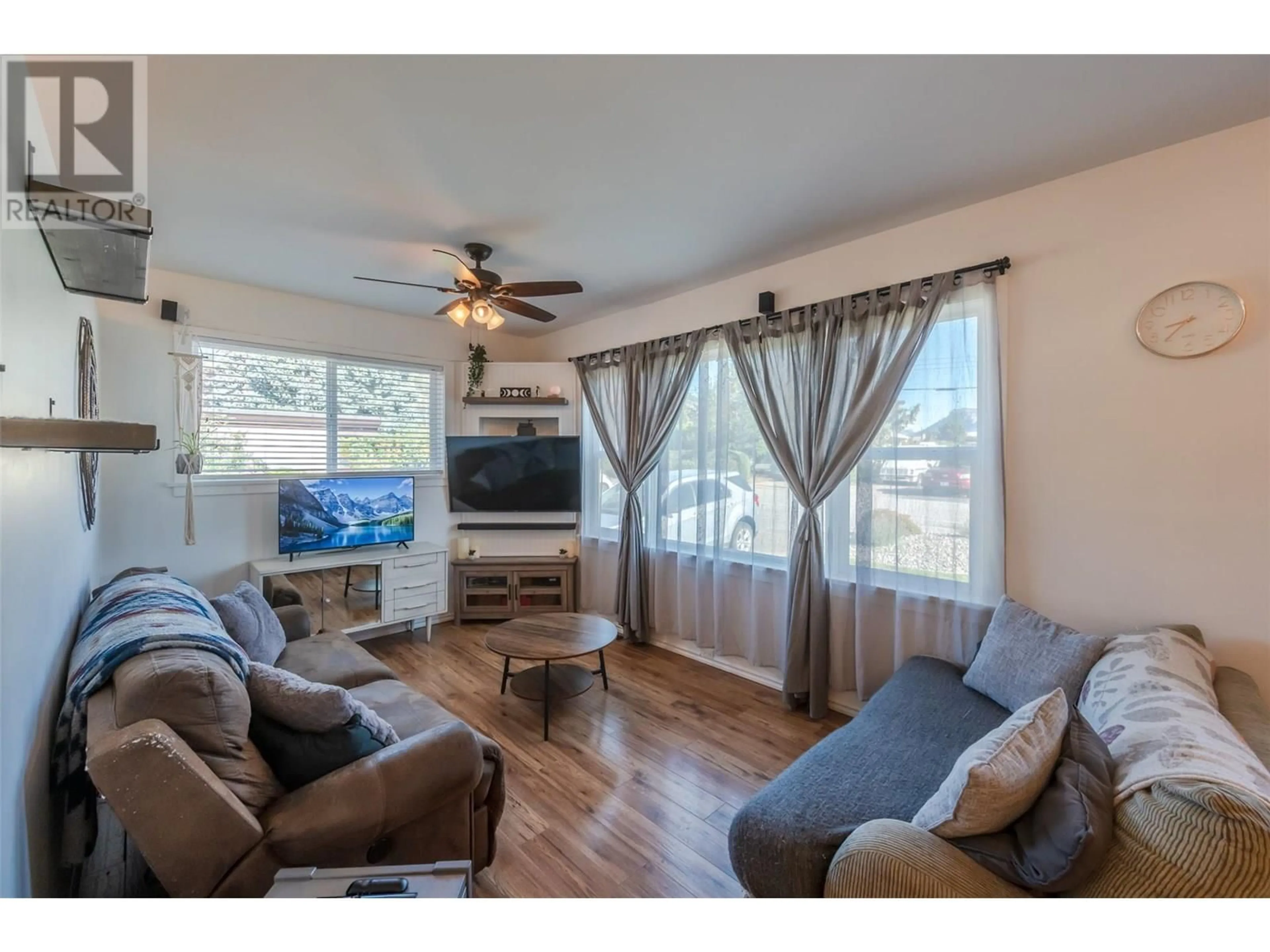 Living room with furniture, wood/laminate floor for 11105 WARD STREET, Summerland British Columbia V0H1Z0