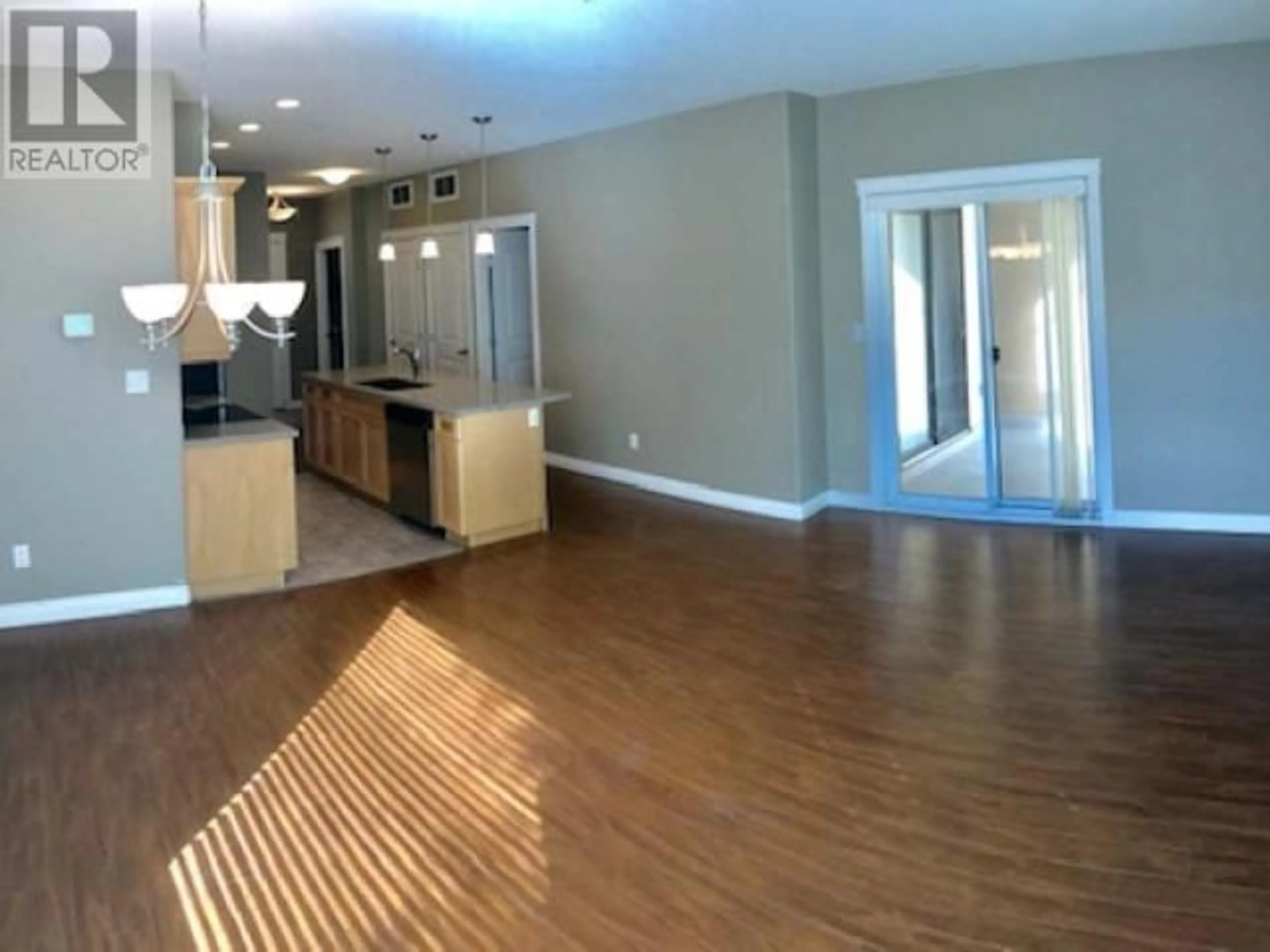 Open concept kitchen, wood/laminate floor for 201 - 3313 WILSON STREET, Penticton British Columbia V2A8J3