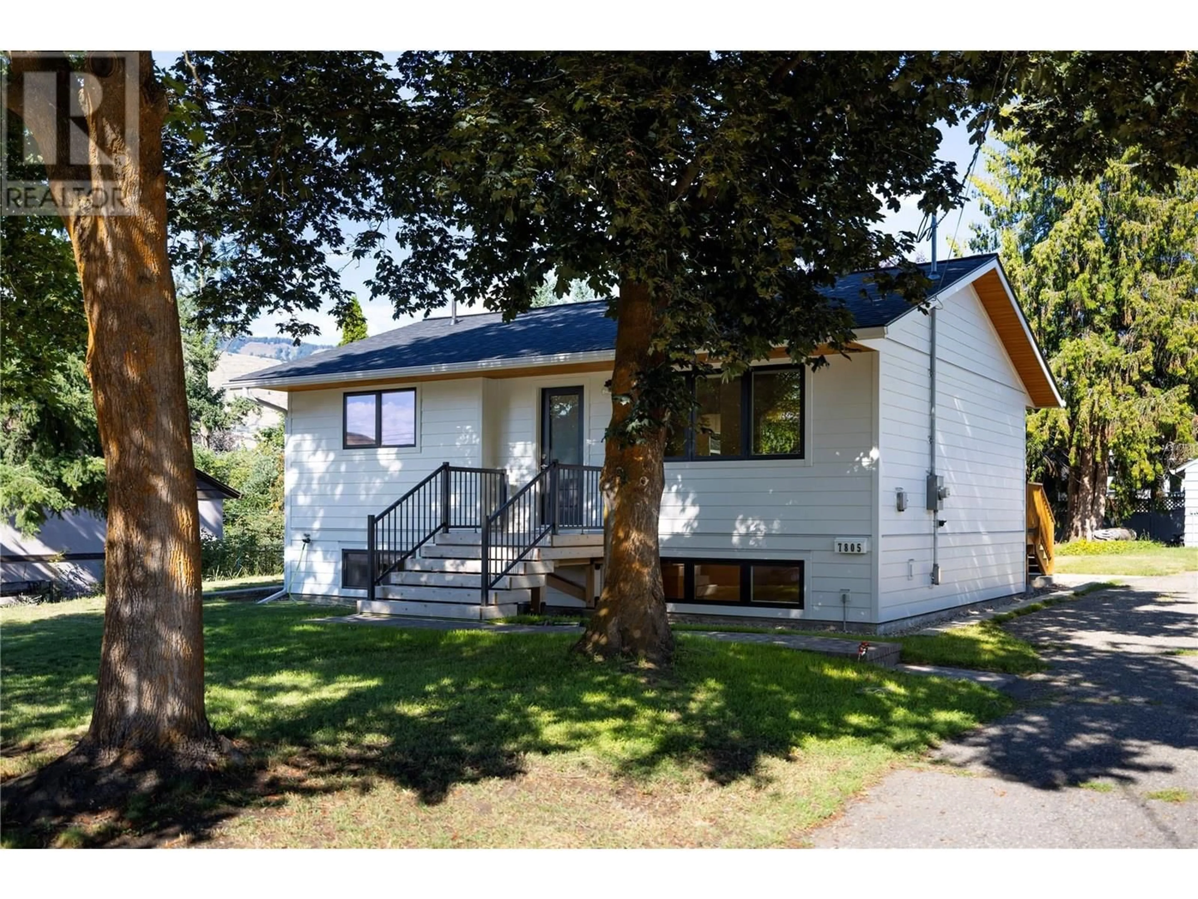 Home with vinyl exterior material, street for 7805 DE JONG DRIVE, Coldstream British Columbia V1B1P2