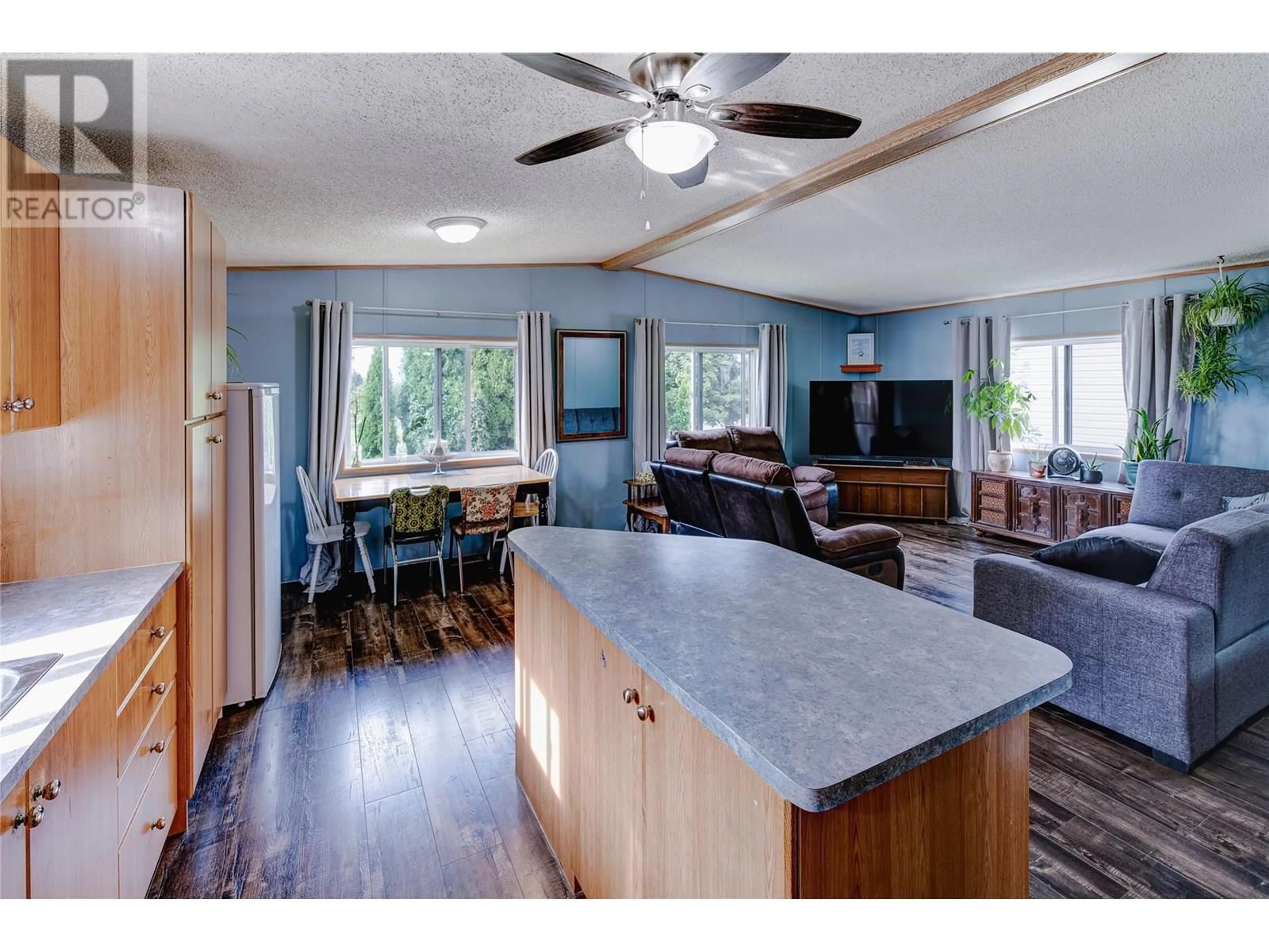 Open concept kitchen, wood/laminate floor for 102 - 5155 CHUTE LAKE ROAD, Kelowna British Columbia V1W4R9