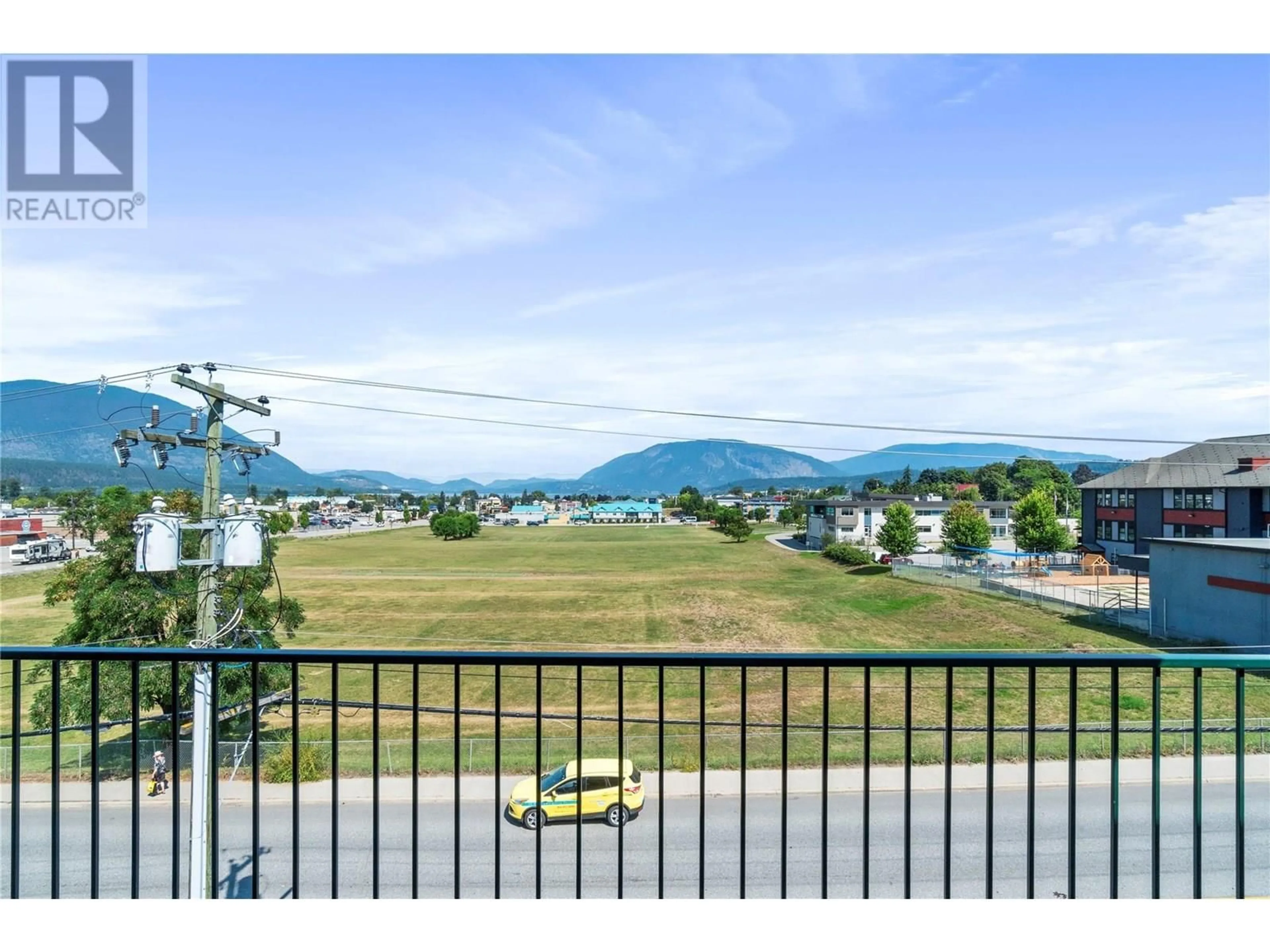 A pic from outside/outdoor area/front of a property/back of a property/a pic from drone, mountain view for 401 - 160 5 AVENUE SOUTHWEST, Salmon Arm British Columbia V1E1R4