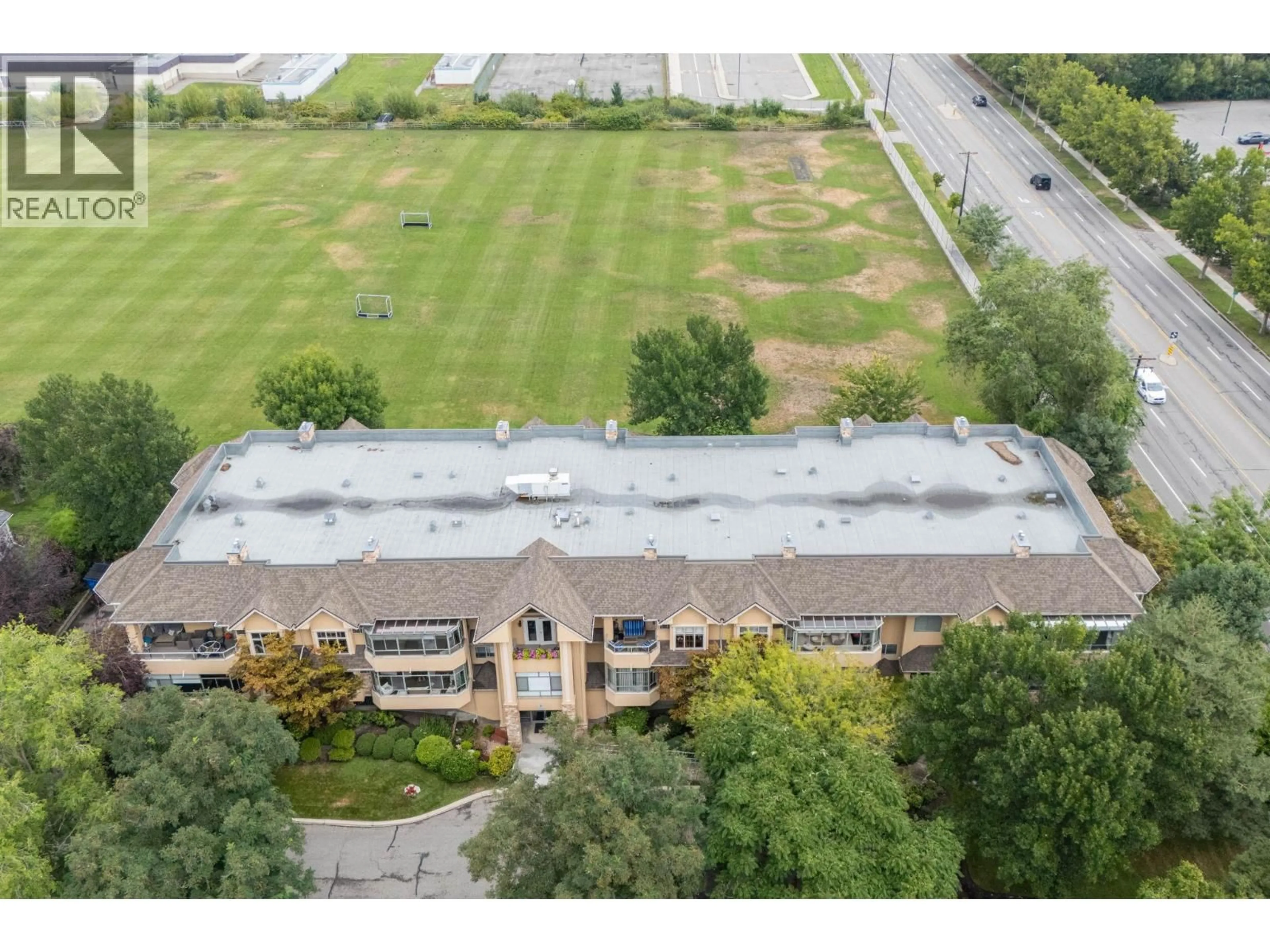 A pic from outside/outdoor area/front of a property/back of a property/a pic from drone, building for 201 - 1152 LANFRANCO ROAD, Kelowna British Columbia V1W3W5