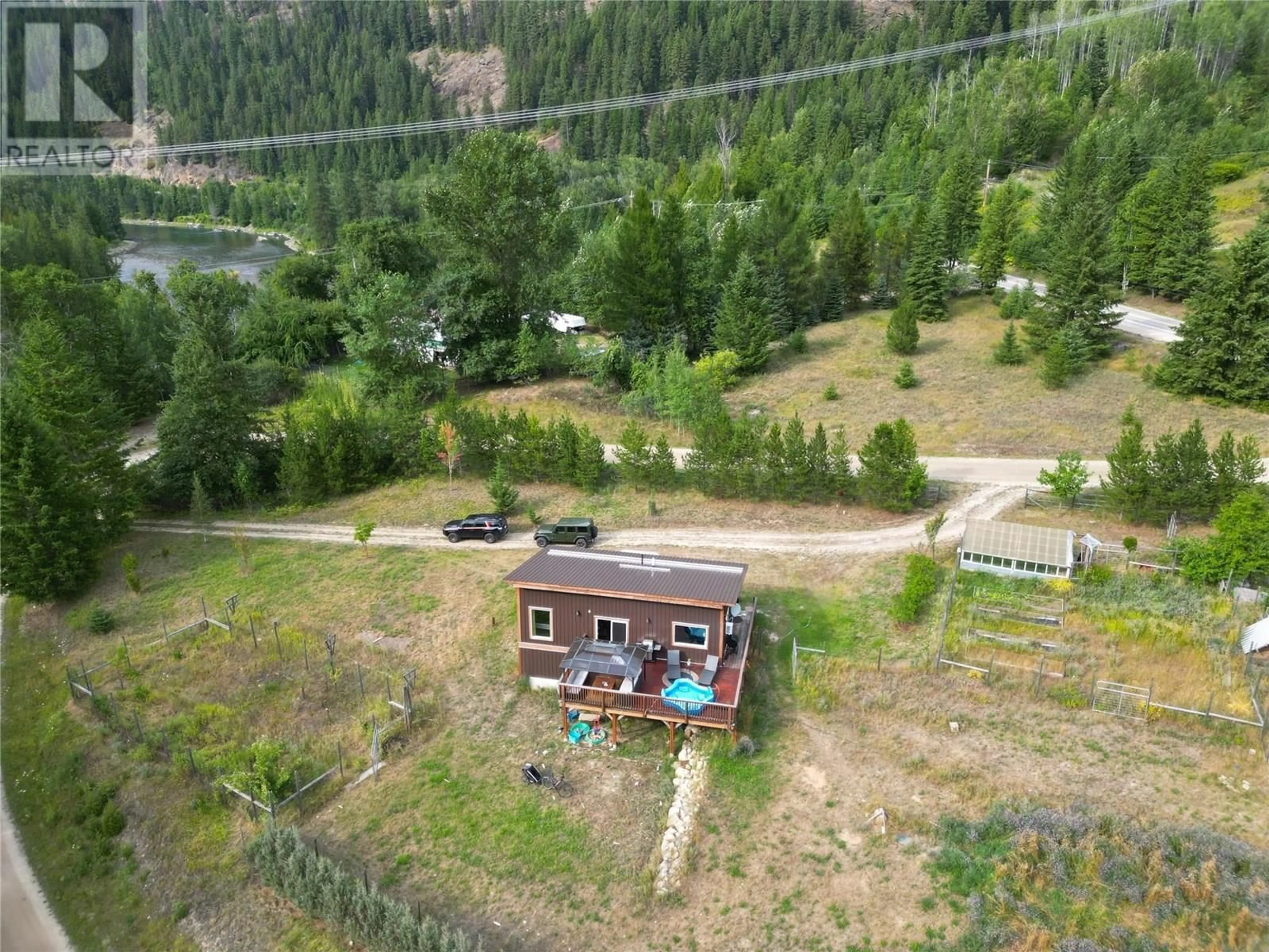 A pic from outside/outdoor area/front of a property/back of a property/a pic from drone, unknown for 3364 KOCH SIDING ROAD, Slocan Park British Columbia V0G2E0