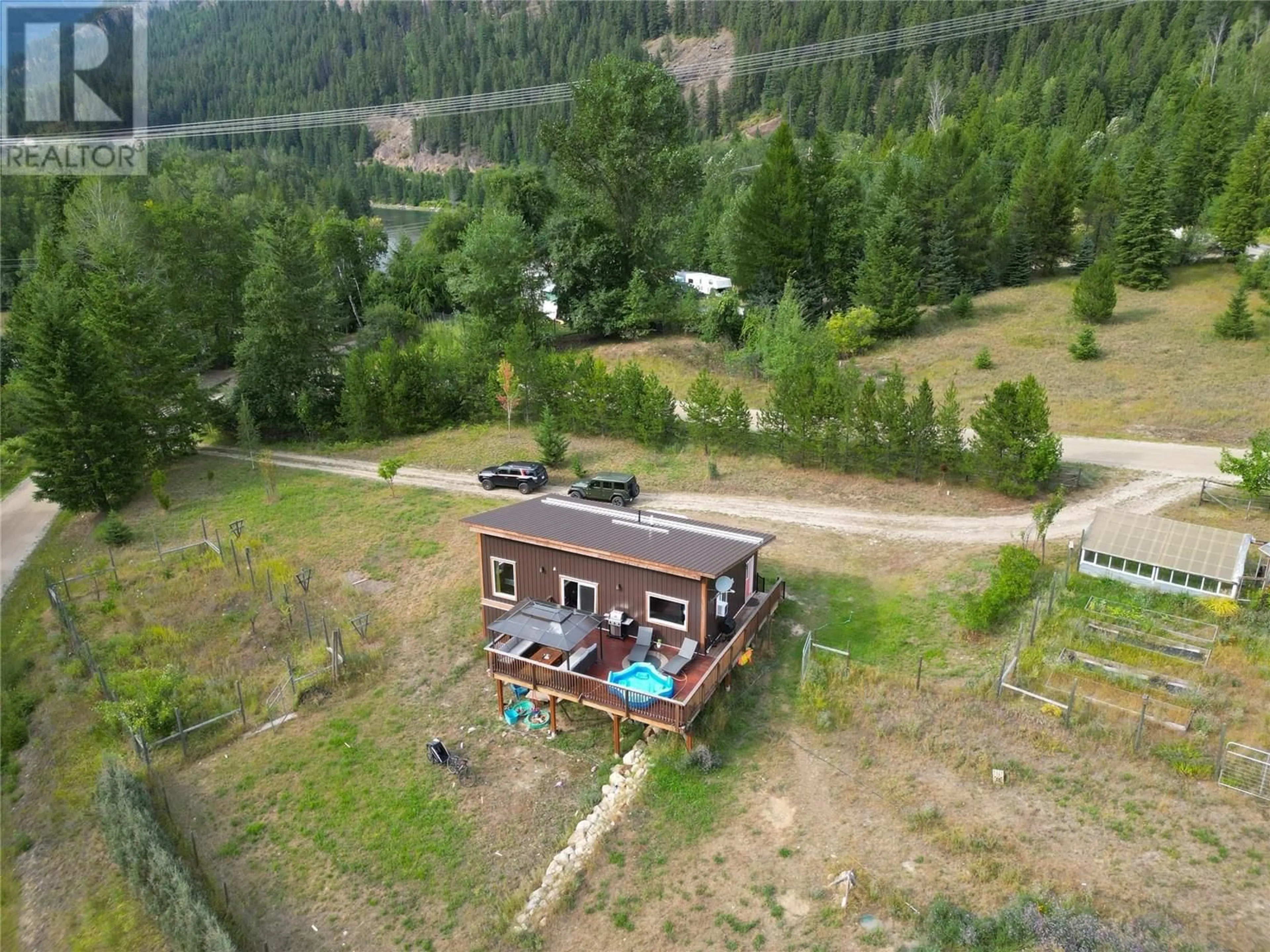 A pic from outside/outdoor area/front of a property/back of a property/a pic from drone, unknown for 3364 KOCH SIDING ROAD, Slocan Park British Columbia V0G2E0
