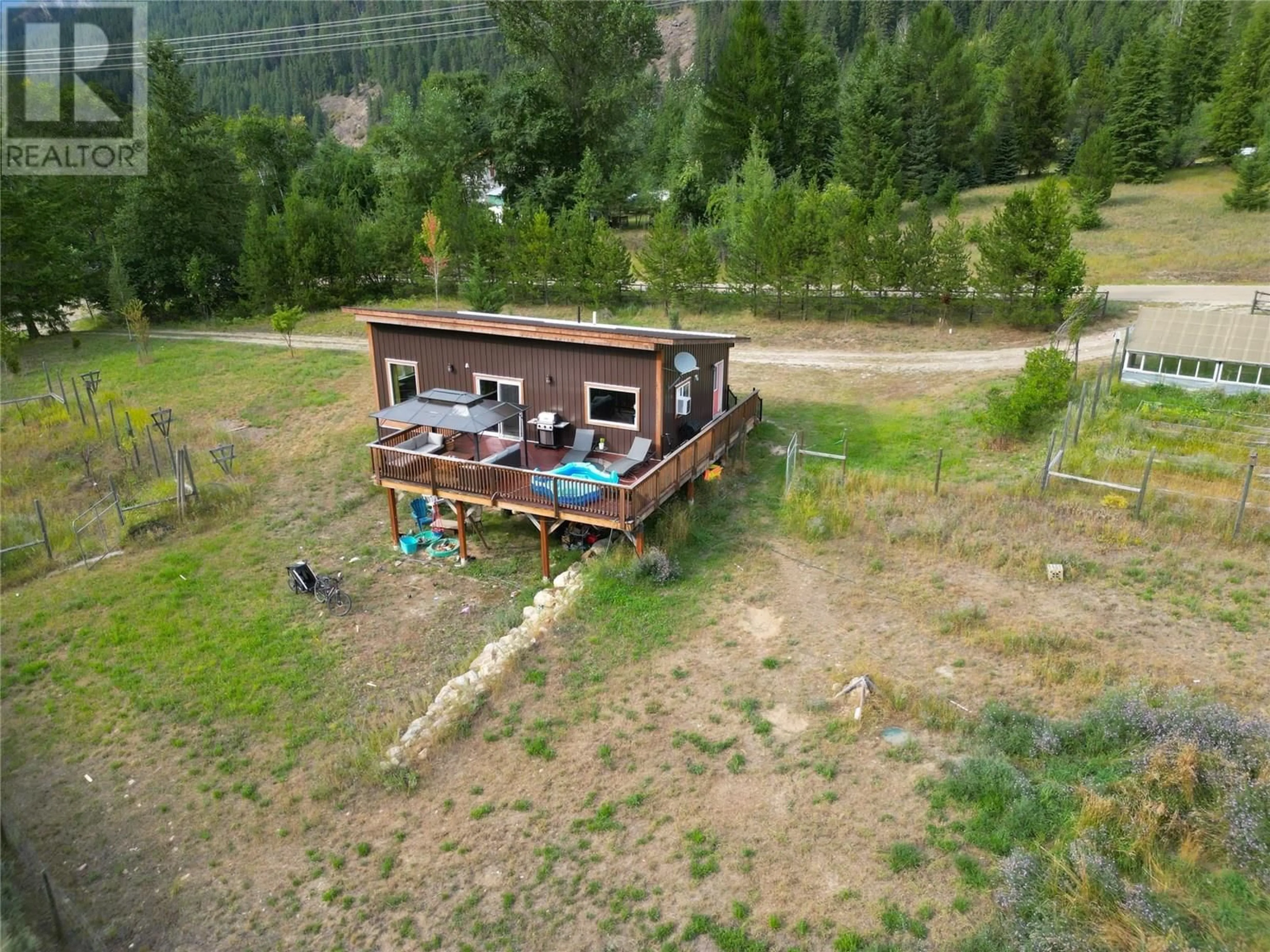 A pic from outside/outdoor area/front of a property/back of a property/a pic from drone, mountain view for 3364 KOCH SIDING ROAD, Slocan Park British Columbia V0G2E0