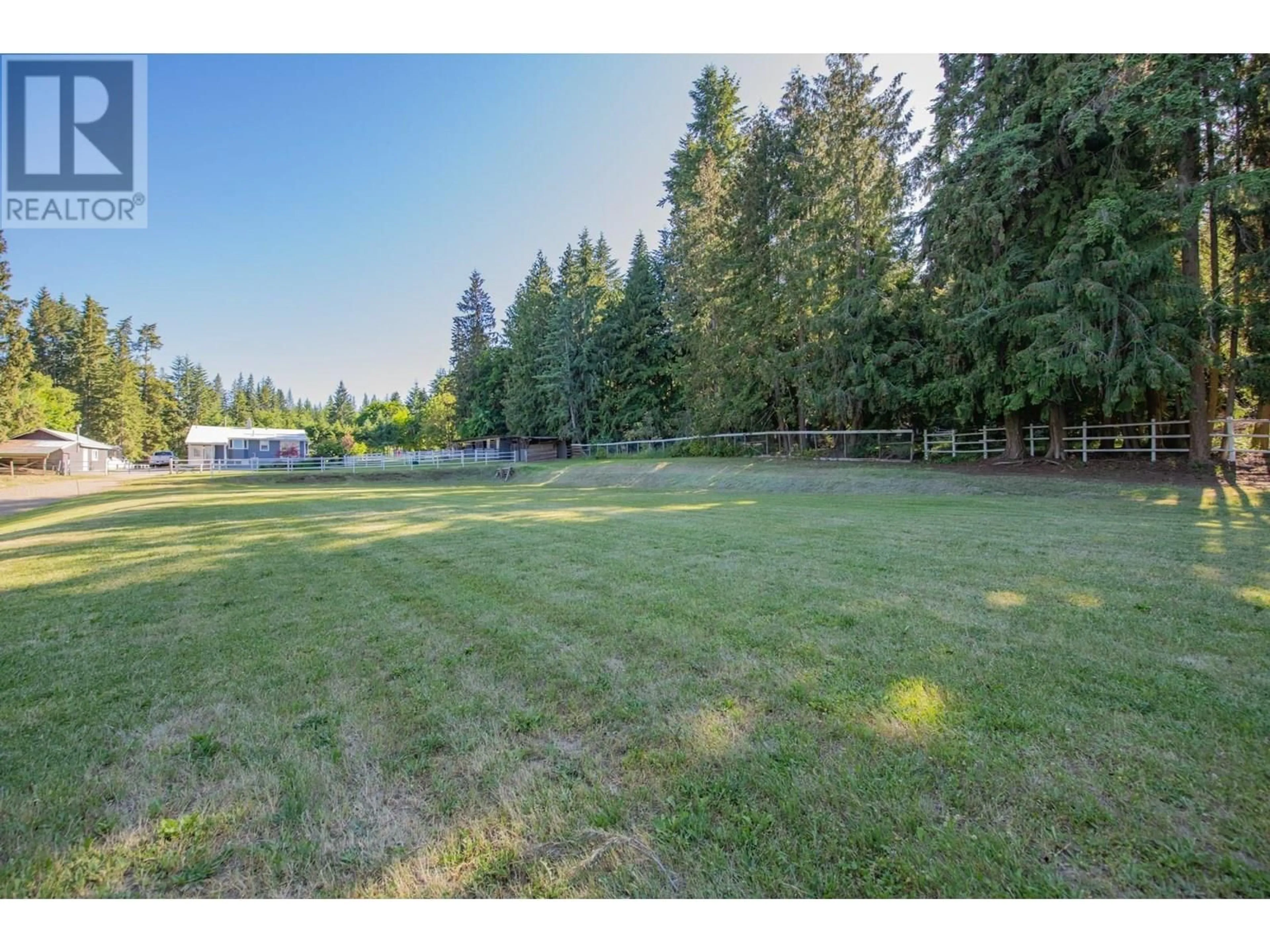A pic from outside/outdoor area/front of a property/back of a property/a pic from drone, forest/trees view for 4091 10 AVENUE SOUTHEAST, Salmon Arm British Columbia V1E1W7
