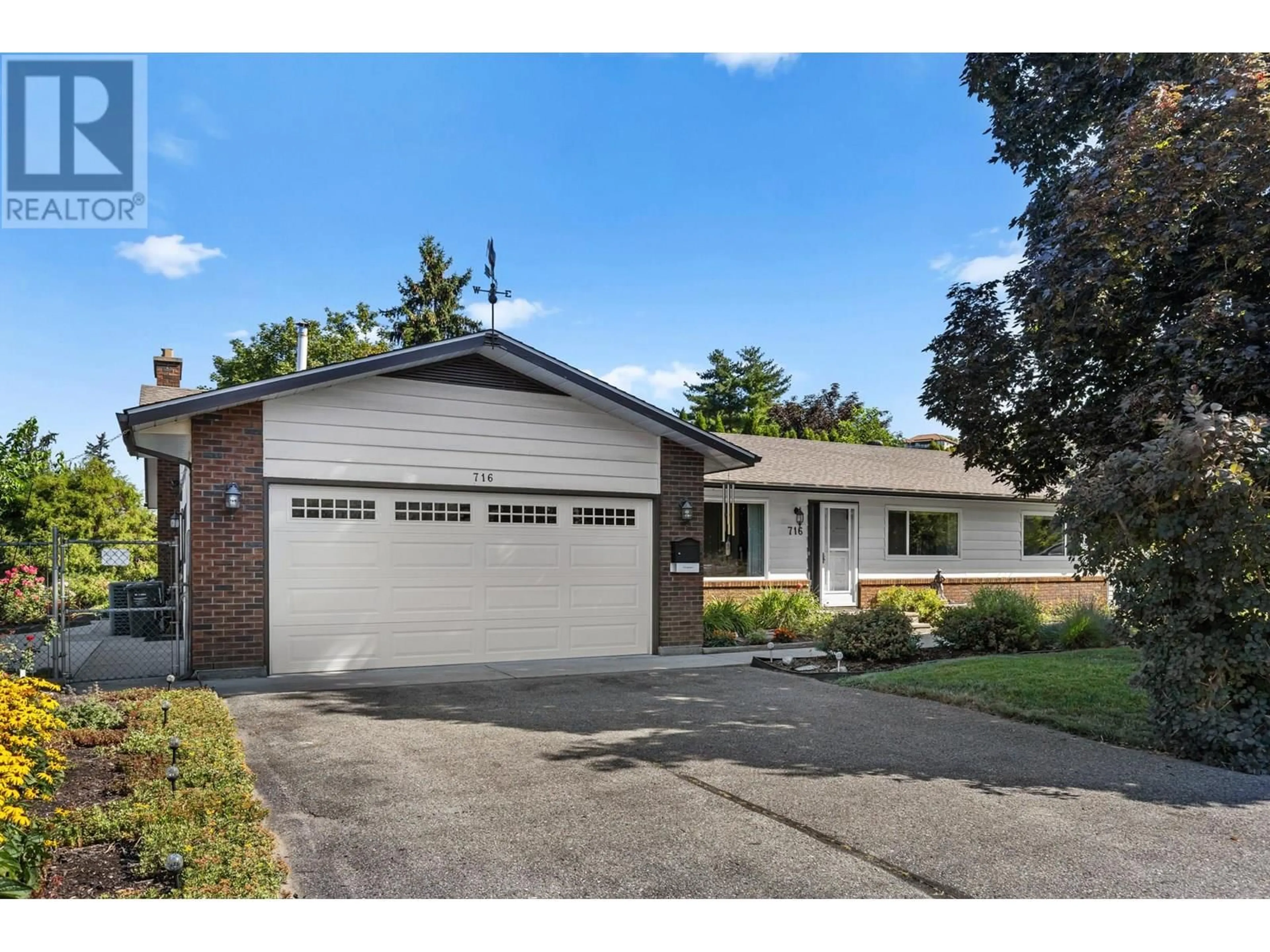 Home with brick exterior material, street for 716 RAYMER ROAD, Kelowna British Columbia v1w1h5