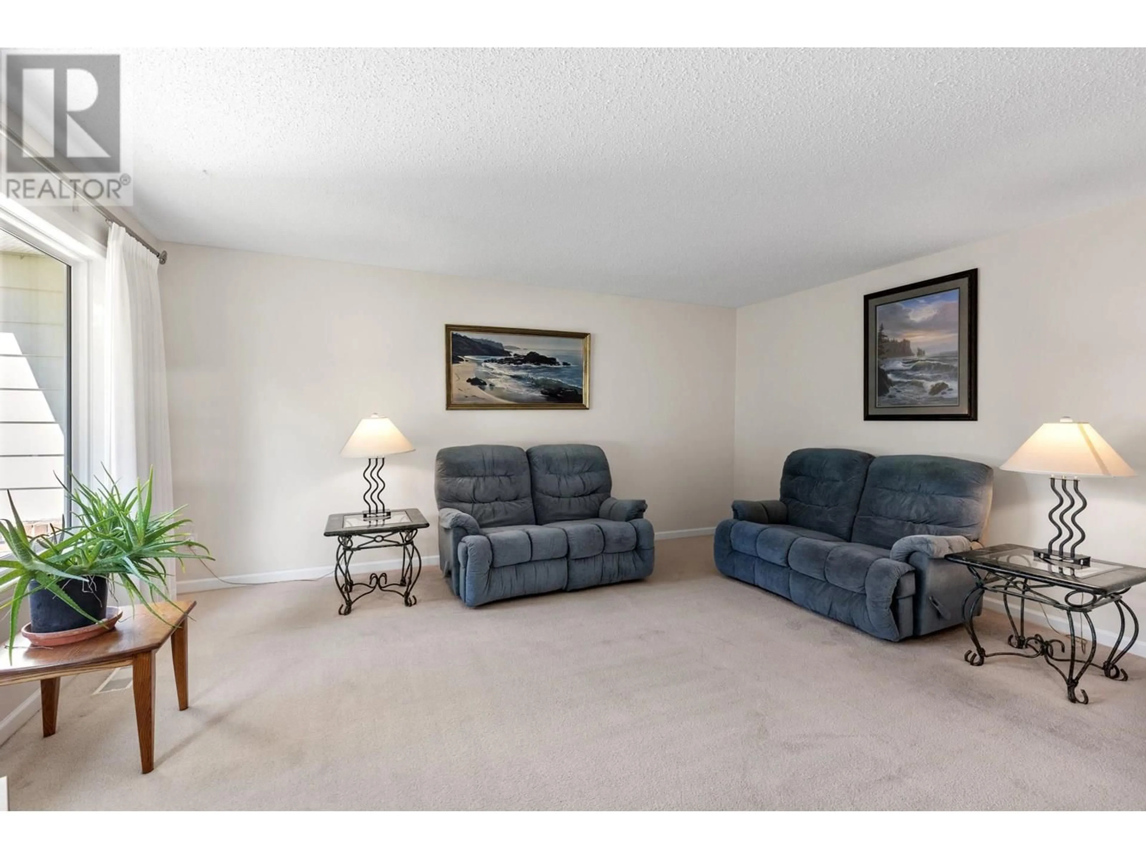 Living room with furniture, carpet floor for 716 RAYMER ROAD, Kelowna British Columbia v1w1h5