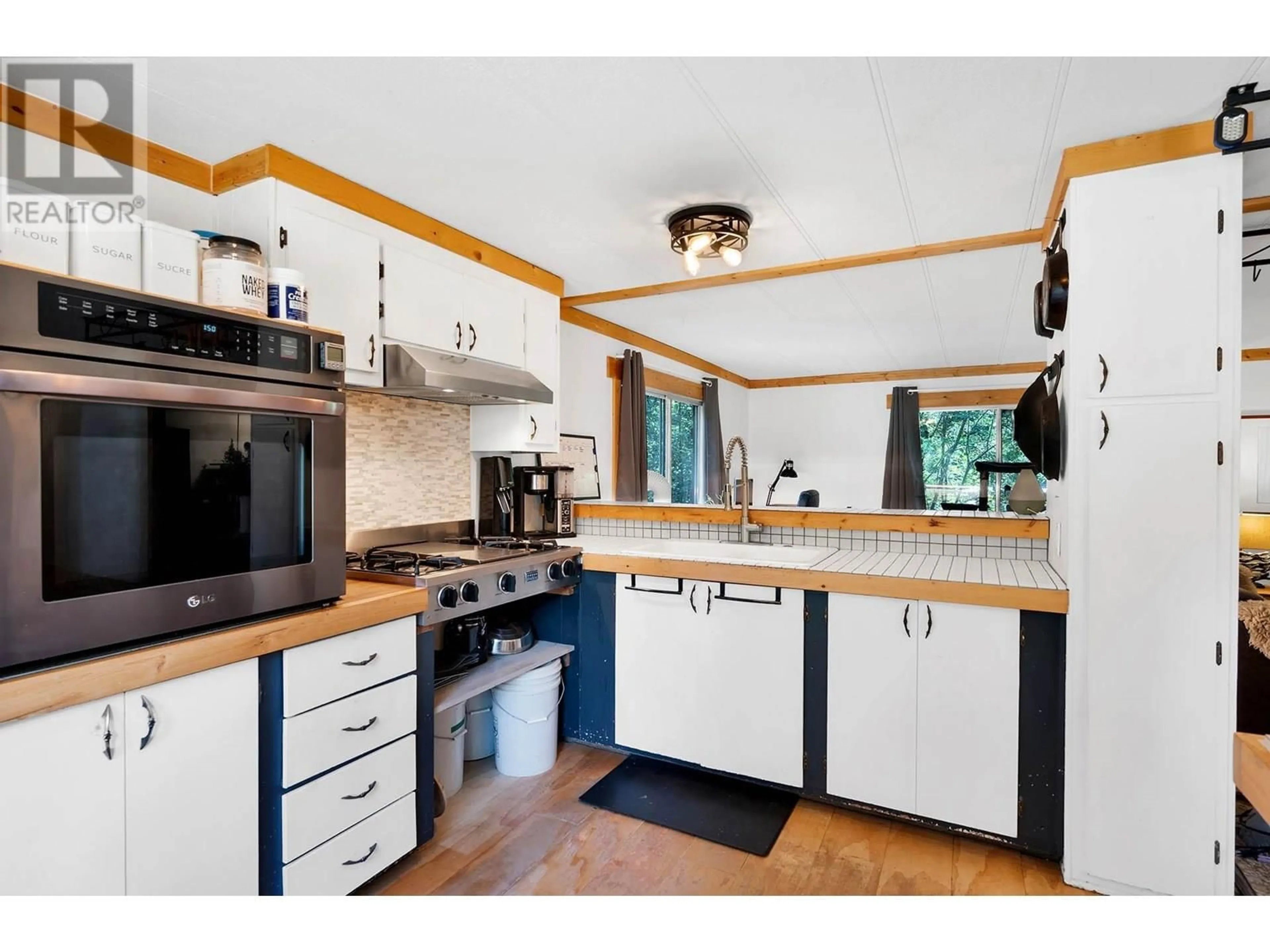 Open concept kitchen, wood/laminate floor for 745 BIRCH DRIVE, Clearwater British Columbia V0E1N1