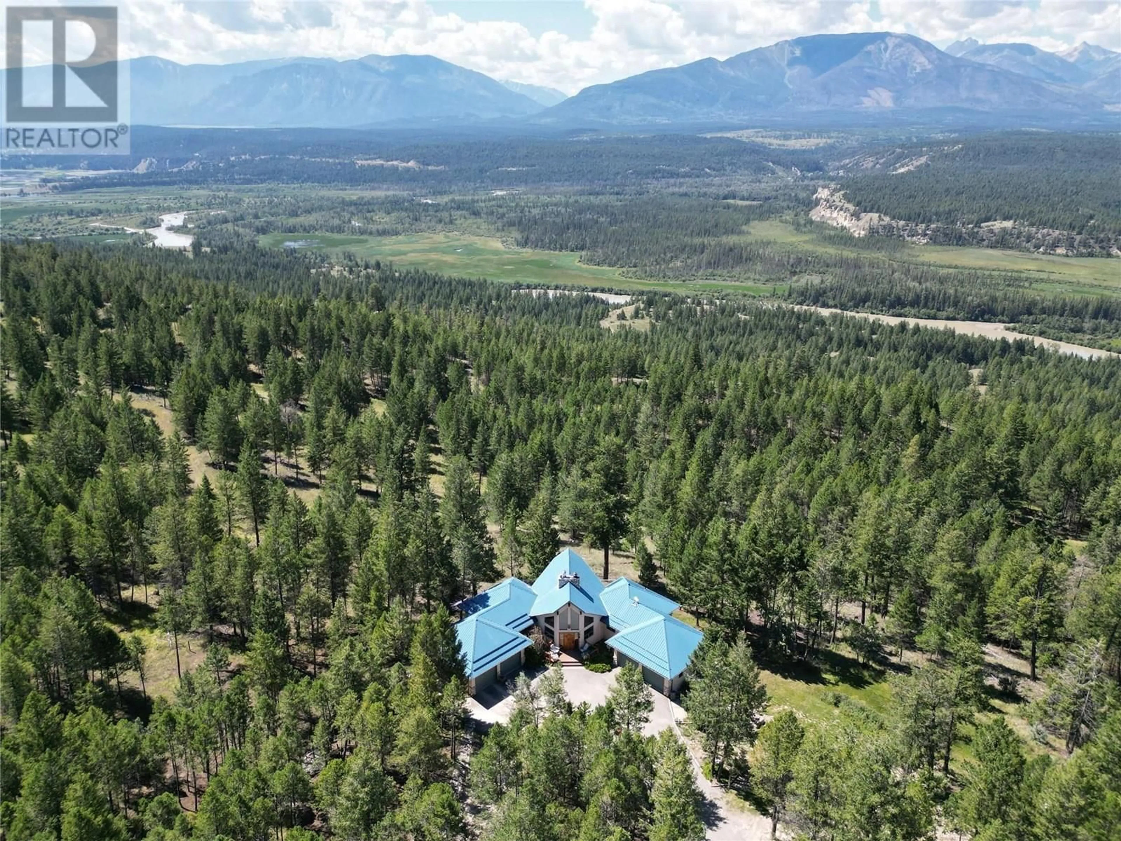 A pic from outside/outdoor area/front of a property/back of a property/a pic from drone, mountain view for 8161 93/95 HIGHWAY, Radium Hot Springs British Columbia V0A1M0