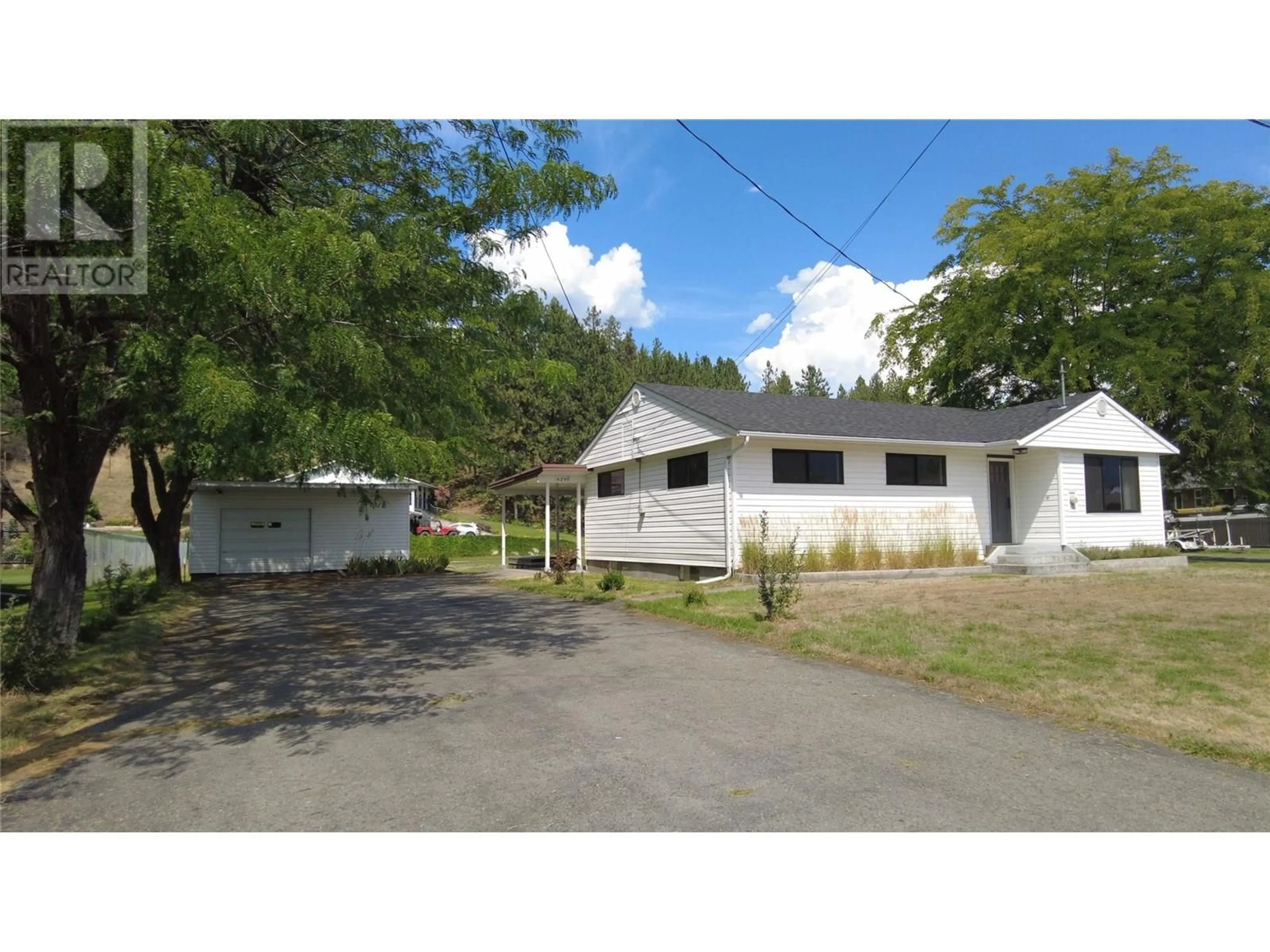 A pic from outside/outdoor area/front of a property/back of a property/a pic from drone, street for 6295 COLLEGE ROAD, Grand Forks British Columbia V0H1H2
