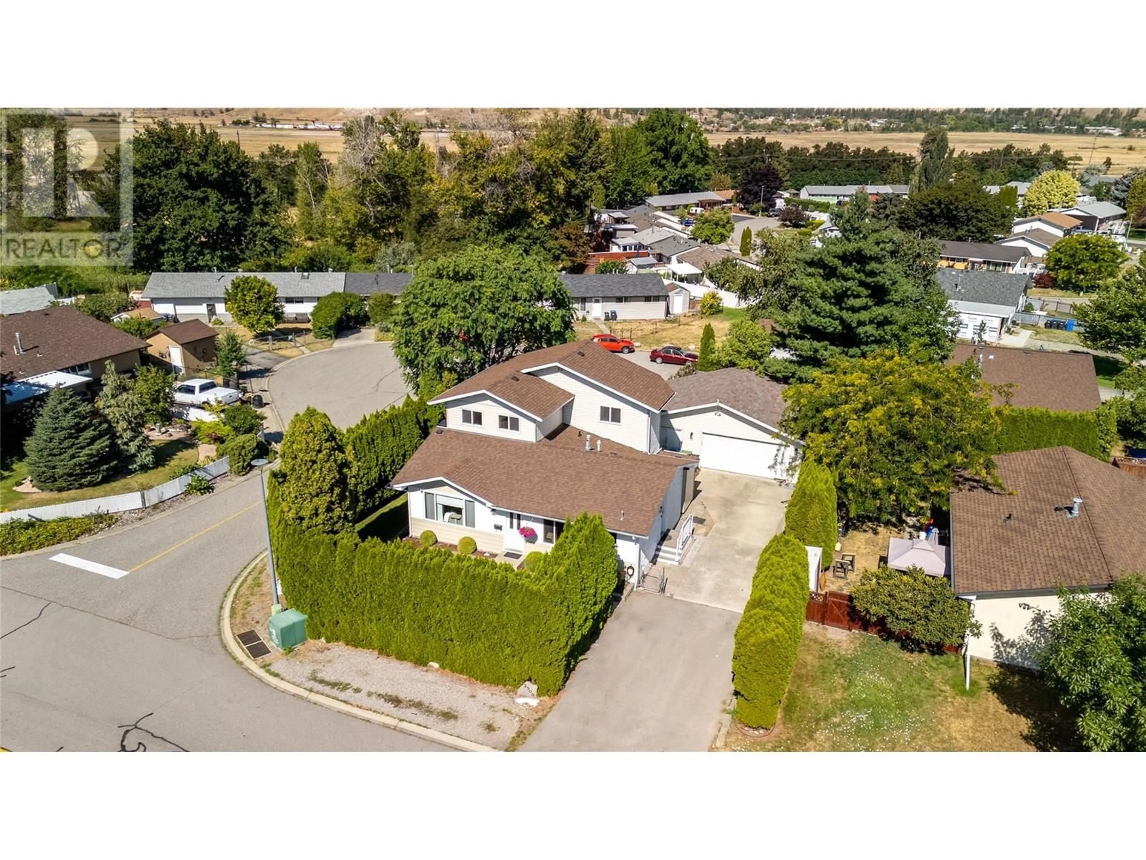 A pic from outside/outdoor area/front of a property/back of a property/a pic from drone, street for 2509 CORNWALL DRIVE, Penticton British Columbia V2A6R8