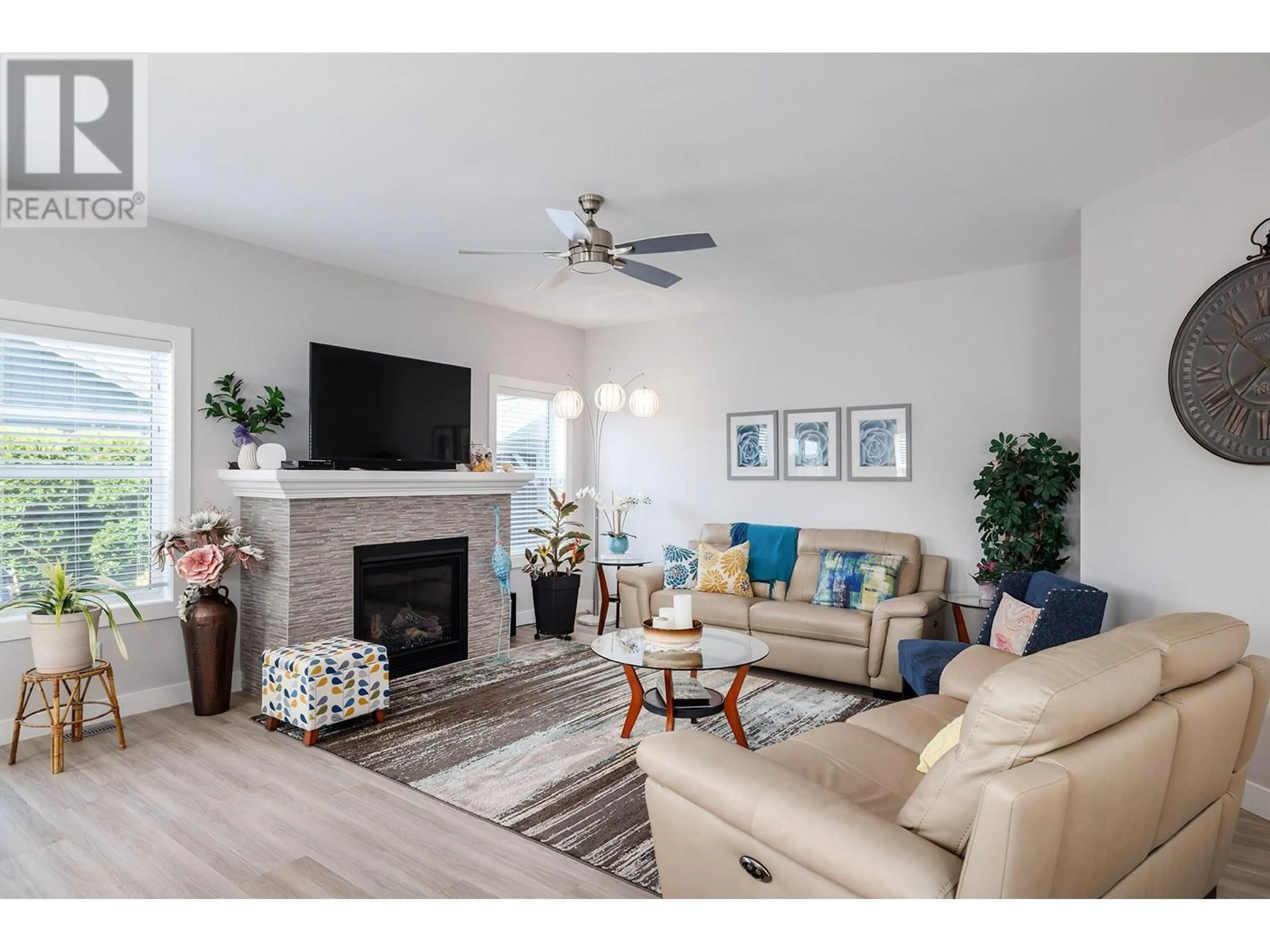 Living room with furniture, wood/laminate floor for 3339 MIMOSA DRIVE, Westbank British Columbia V4T3A5