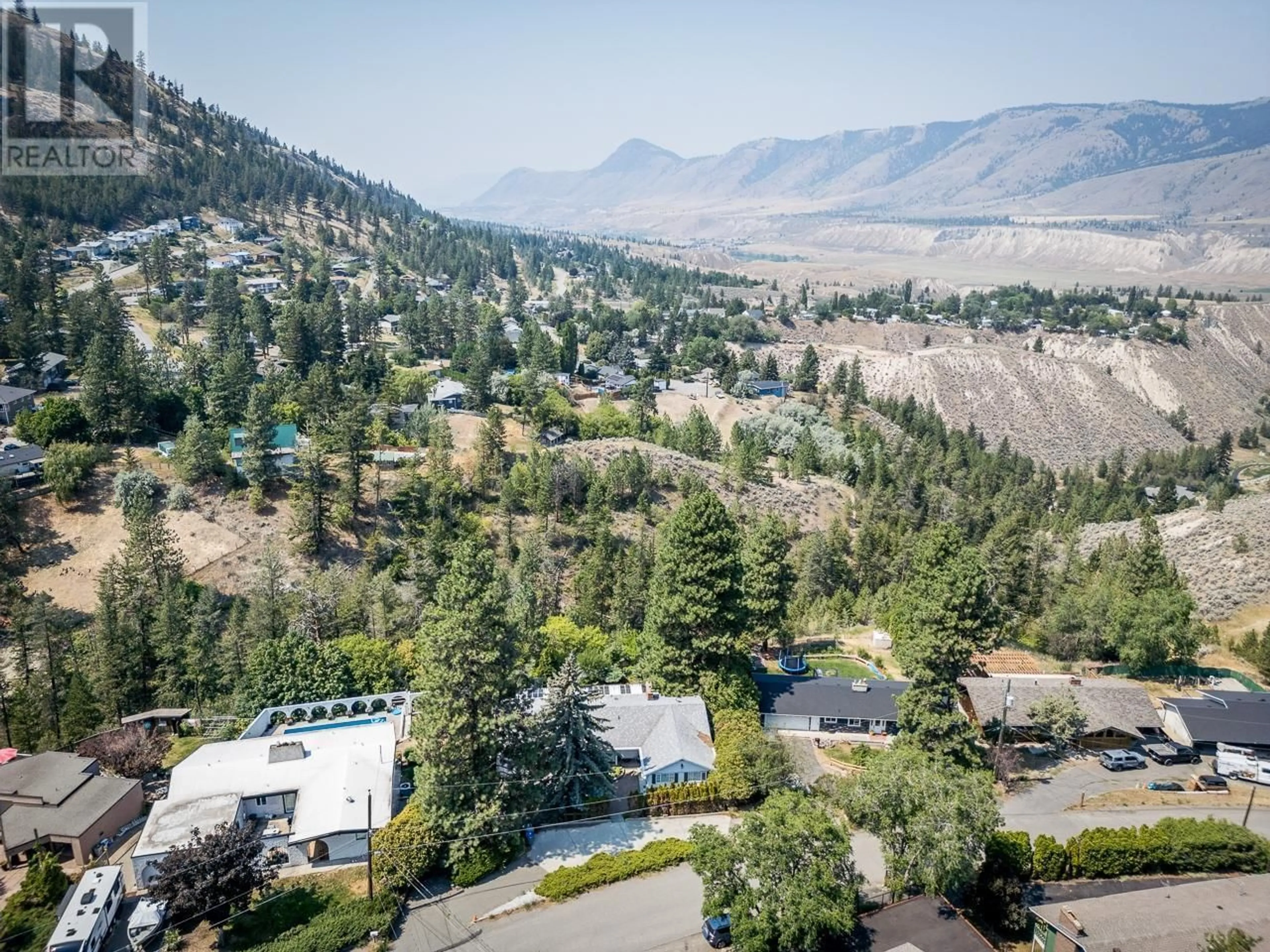 A pic from outside/outdoor area/front of a property/back of a property/a pic from drone, mountain view for 1091 WILDWOOD DRIVE, Kamloops British Columbia V2C5E1