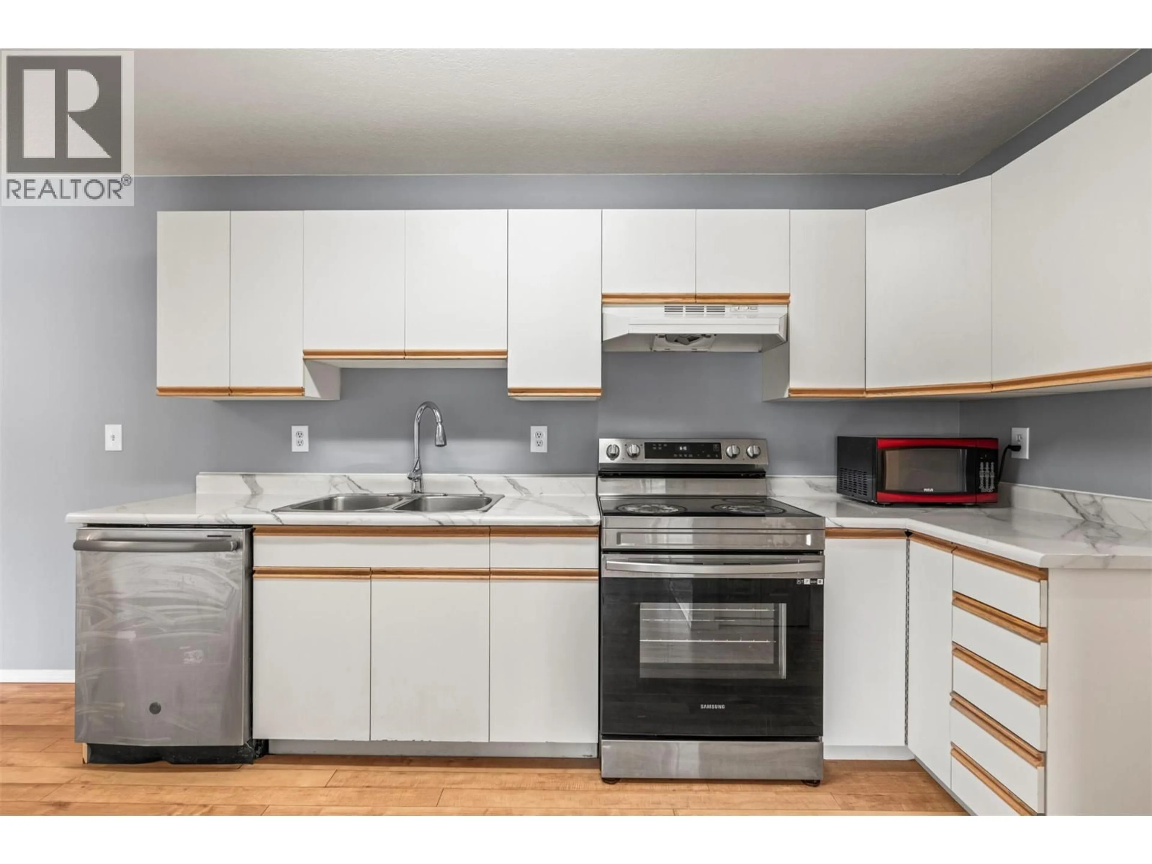 Standard kitchen, wood/laminate floor for 101 - 3802 25 AVENUE, Vernon British Columbia V1T1P3