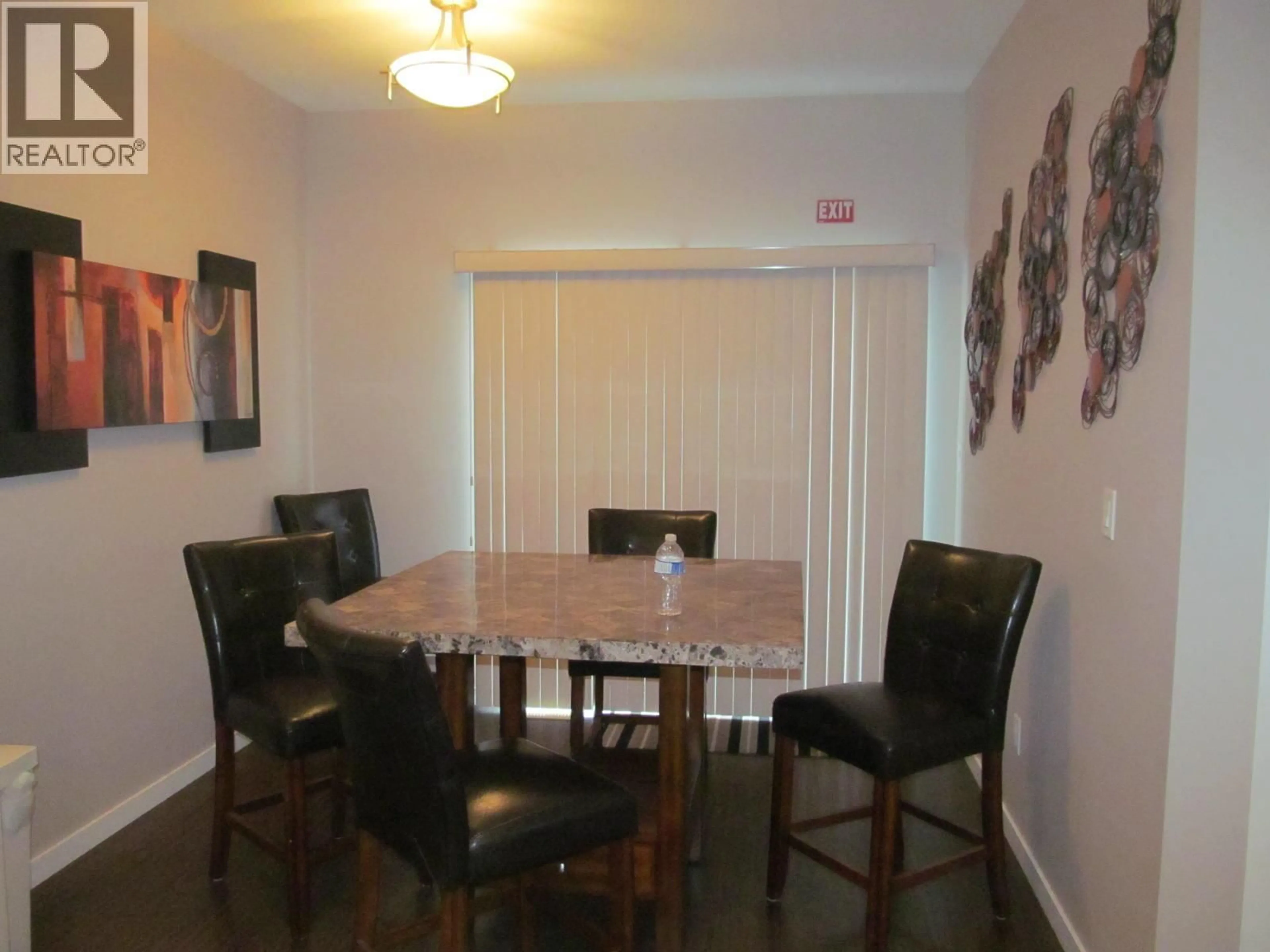 Dining room, wood/laminate floor for 710 / 708 105A STREET, Dawson Creek British Columbia V1G2M8