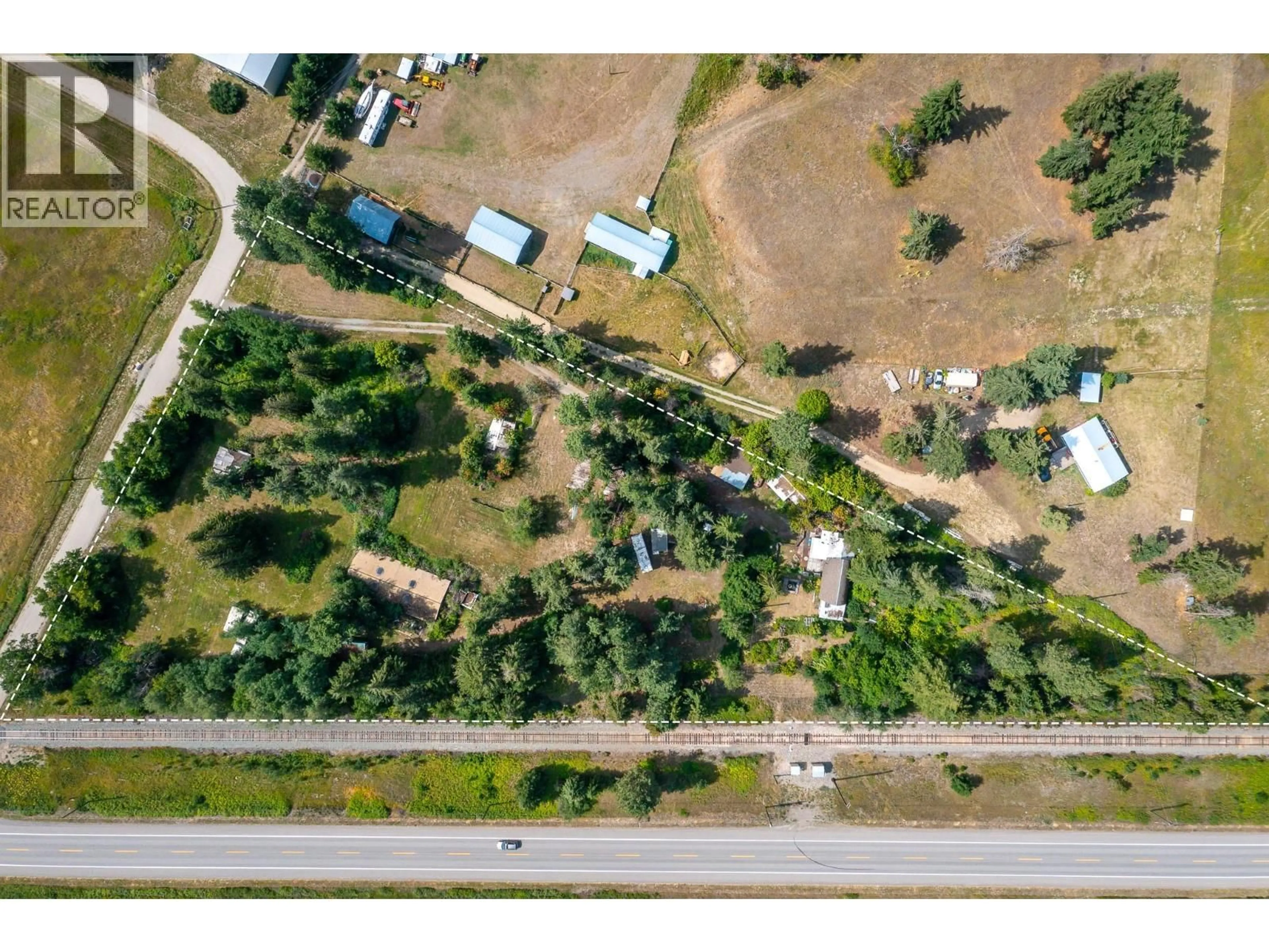 A pic from outside/outdoor area/front of a property/back of a property/a pic from drone, street for 3508 SHAW ROAD, Falkland British Columbia V0E1W1