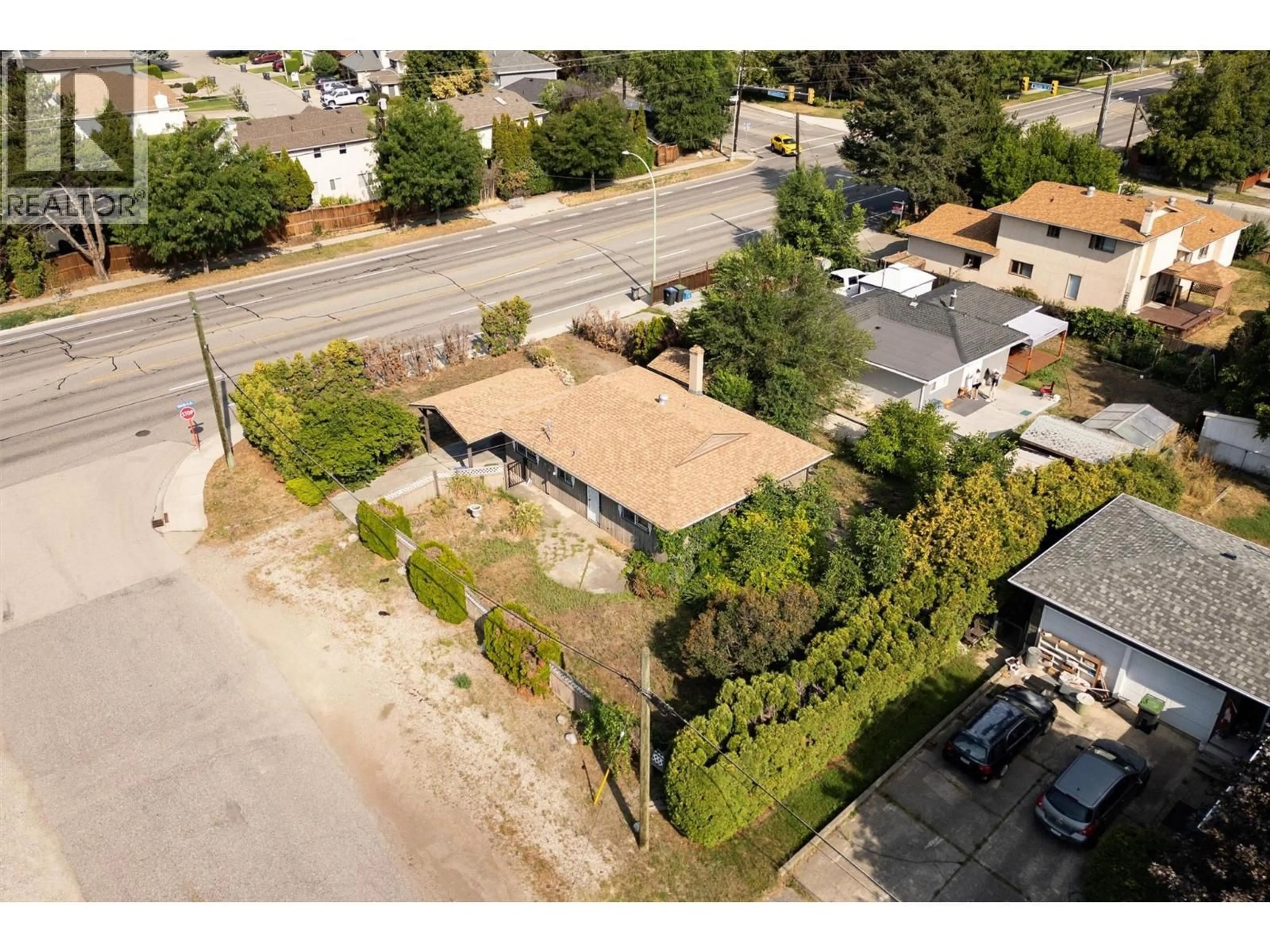 A pic from outside/outdoor area/front of a property/back of a property/a pic from drone, street for 1220 LADNER ROAD, Kelowna British Columbia V1W3M8