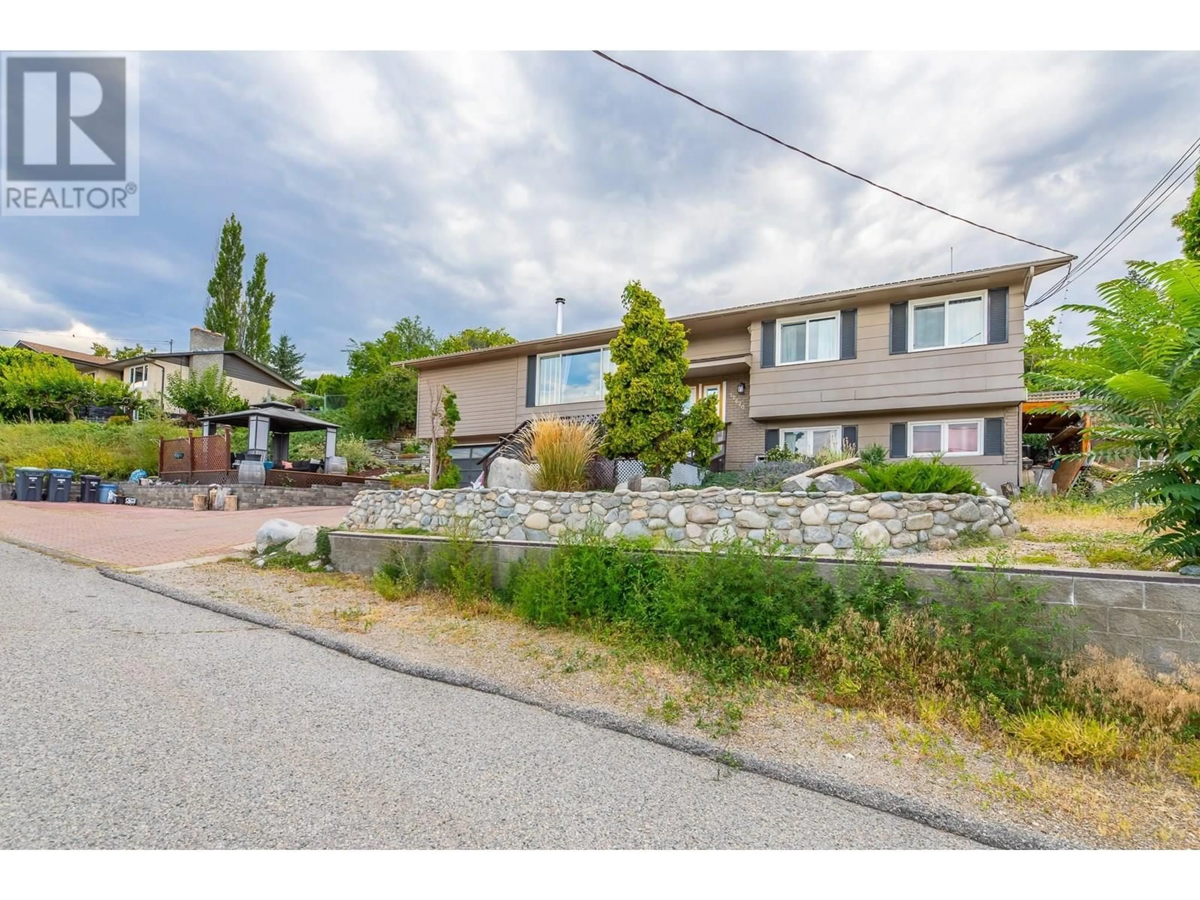 A pic from outside/outdoor area/front of a property/back of a property/a pic from drone, street for 12620 REYNOLDS AVENUE, Summerland British Columbia V0H1Z8