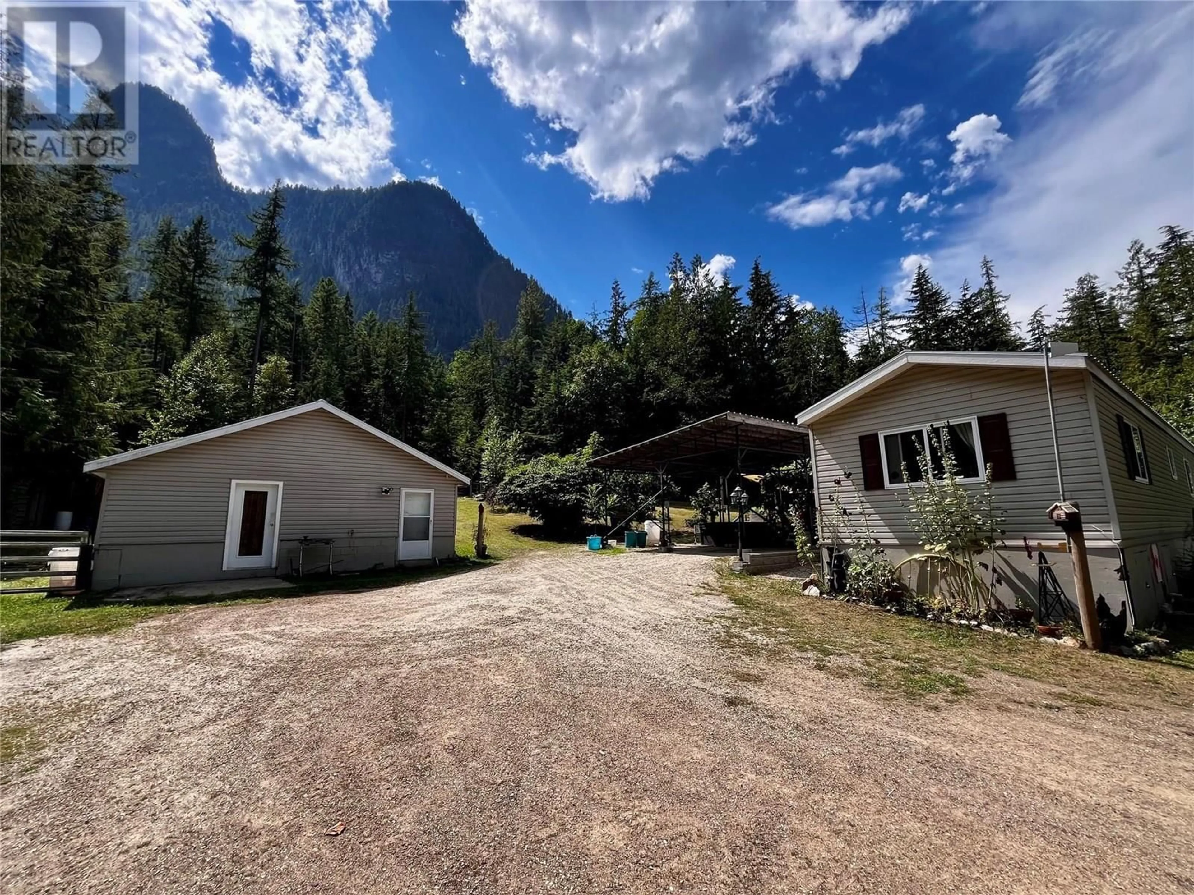 A pic from outside/outdoor area/front of a property/back of a property/a pic from drone, mountain view for 3867 ROCK ISLAND ROAD, Arrow Park British Columbia V0G1R1