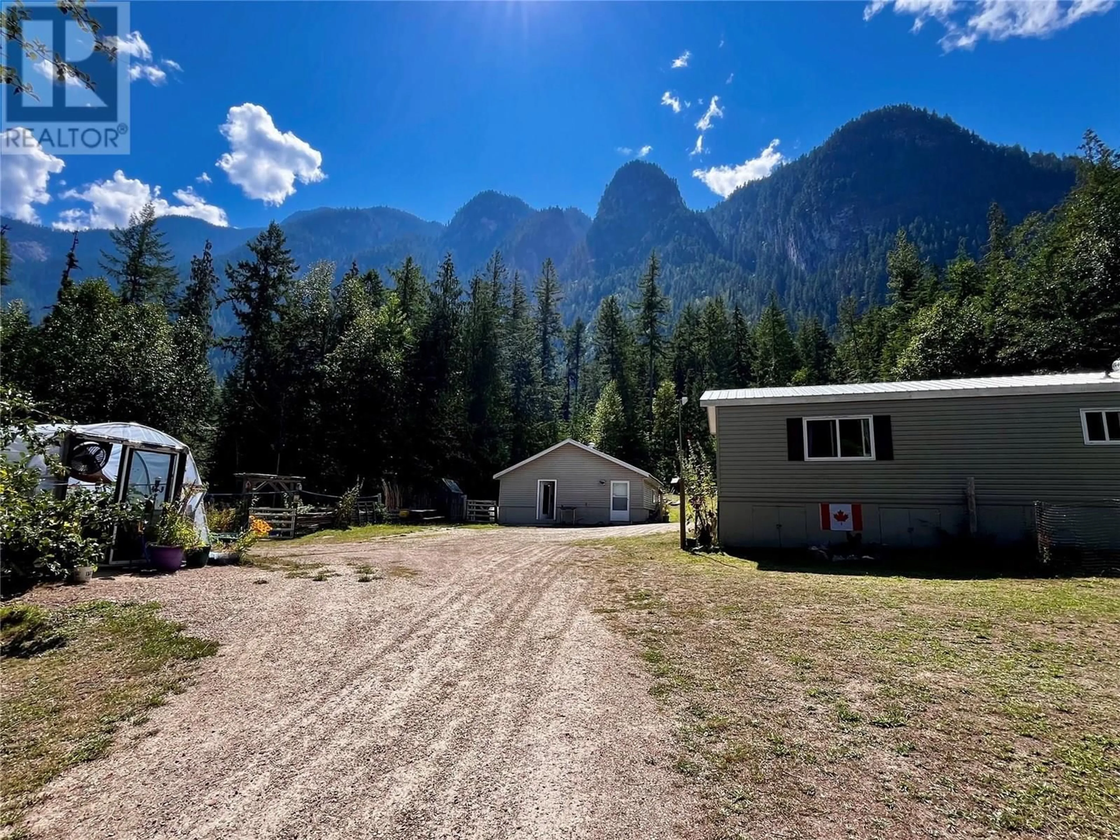 A pic from outside/outdoor area/front of a property/back of a property/a pic from drone, mountain view for 3867 ROCK ISLAND ROAD, Arrow Park British Columbia V0G1R1
