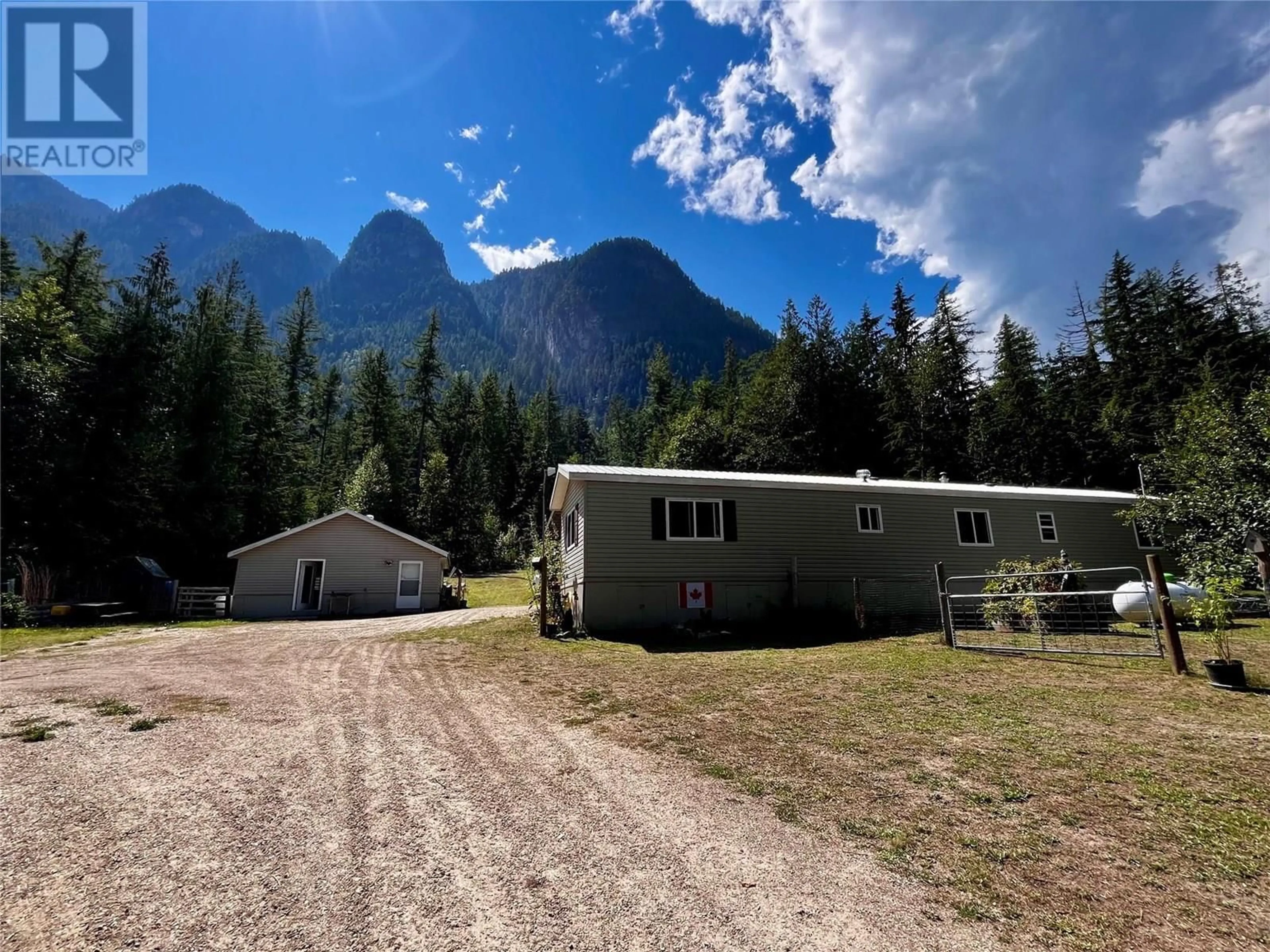 A pic from outside/outdoor area/front of a property/back of a property/a pic from drone, mountain view for 3867 ROCK ISLAND ROAD, Arrow Park British Columbia V0G1R1