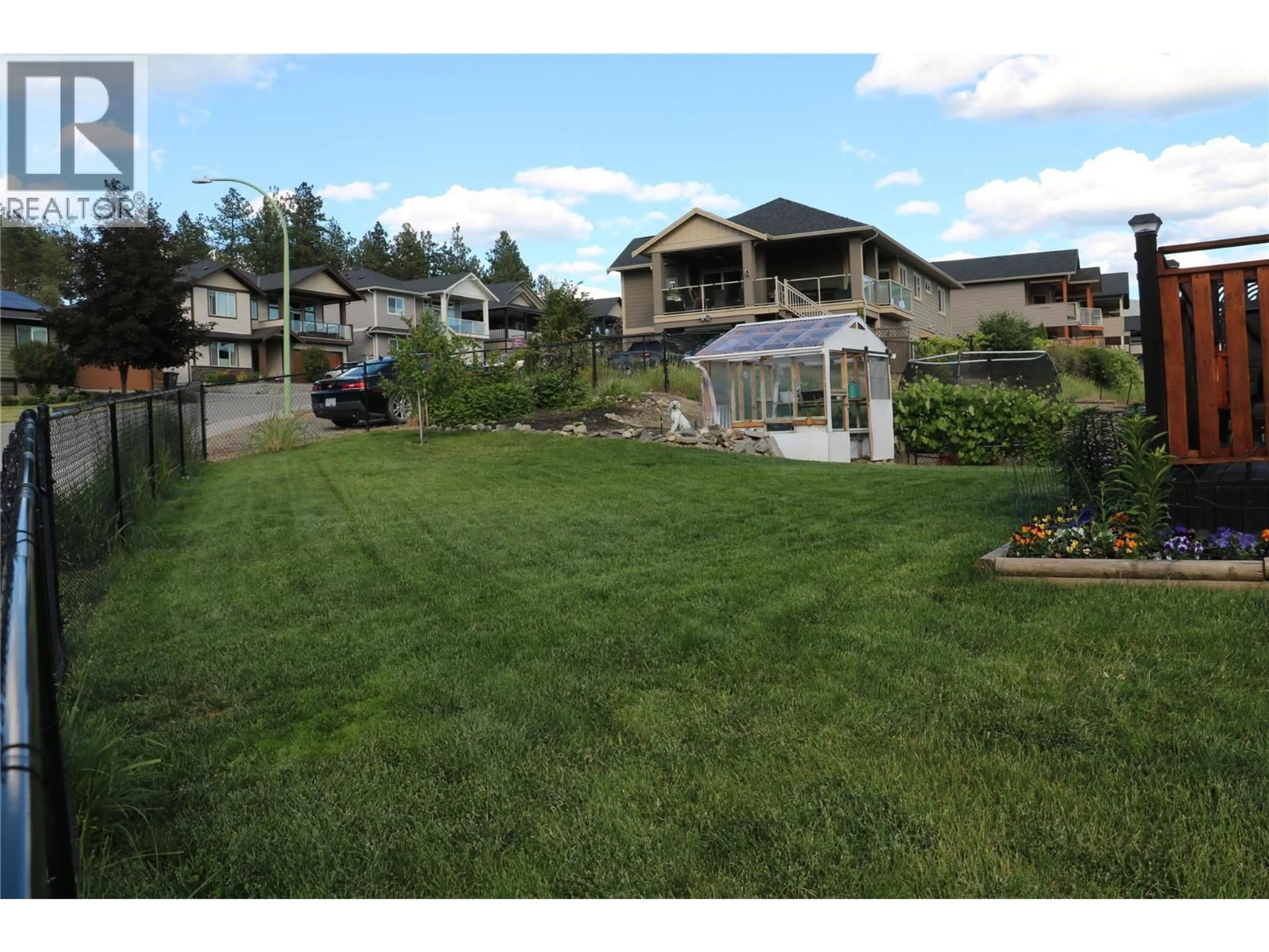 A pic from outside/outdoor area/front of a property/back of a property/a pic from drone, mountain view for 371 ACADEMY WAY, Kelowna British Columbia V1V3A9