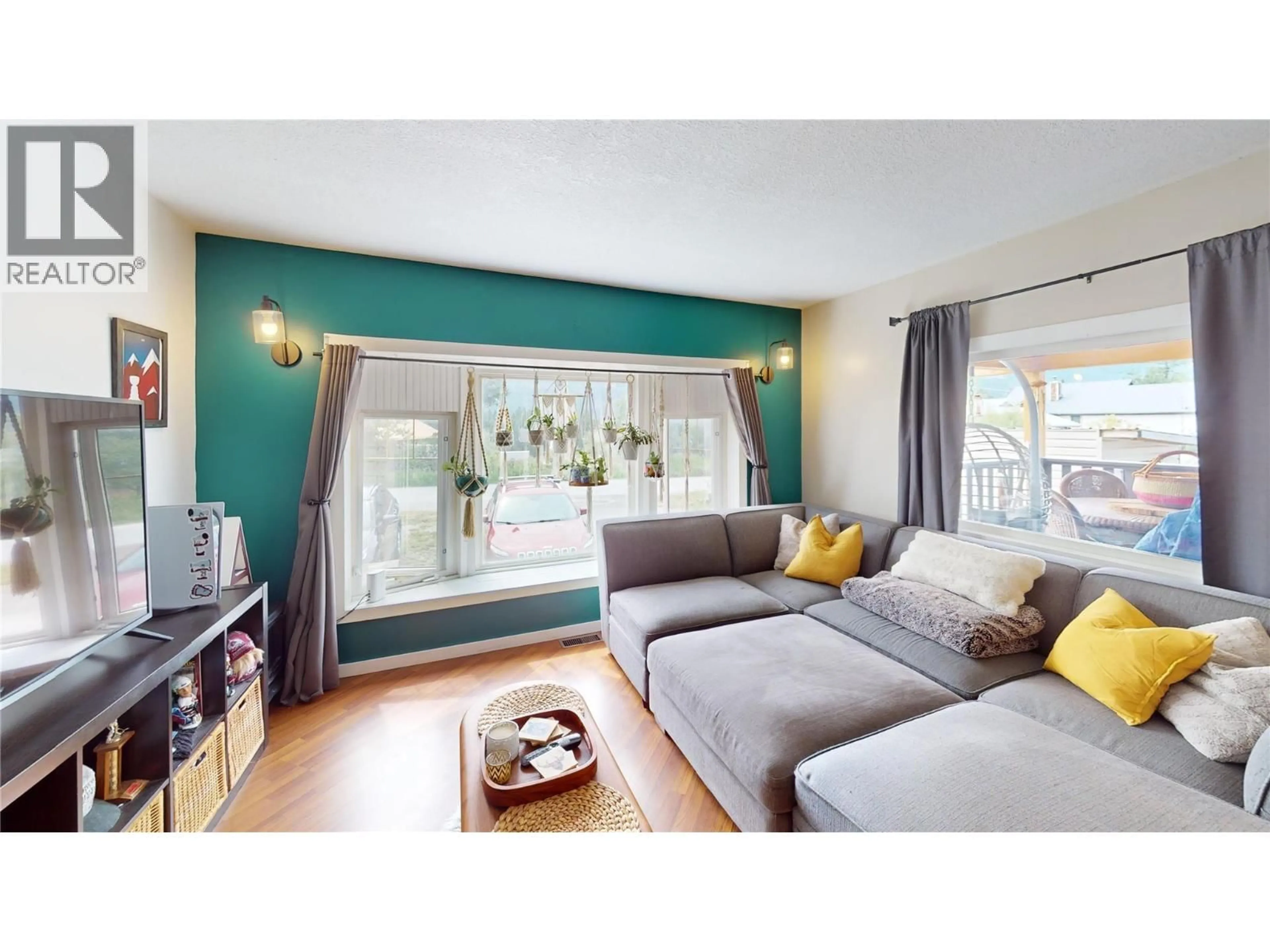 Living room with furniture, wood/laminate floor for 4785 SELKIRK AVENUE, Edgewater British Columbia V0A1E0