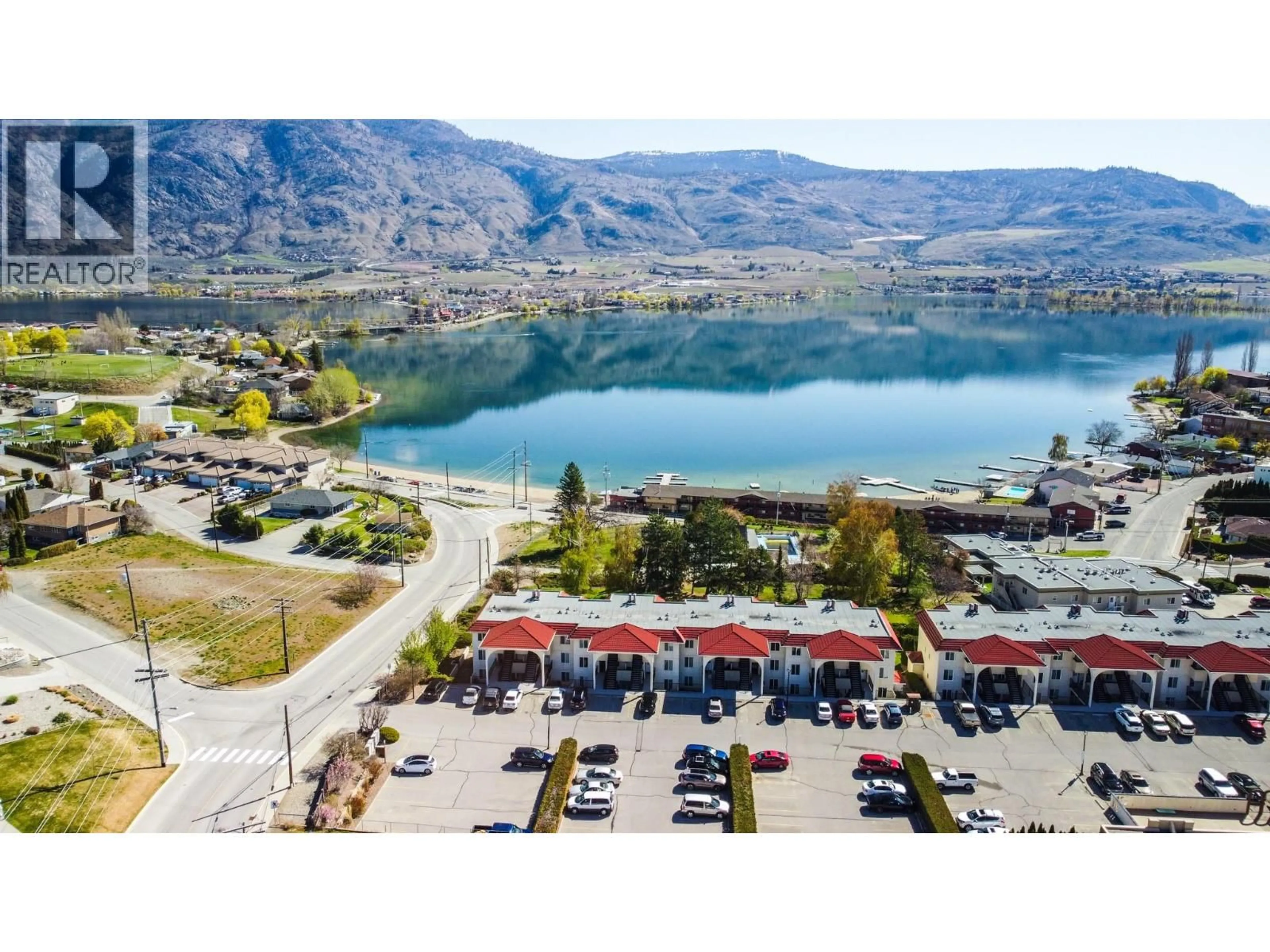 A pic from outside/outdoor area/front of a property/back of a property/a pic from drone, water/lake/river/ocean view for 14 - 9107 62ND AVENUE, Osoyoos British Columbia V0H1V1
