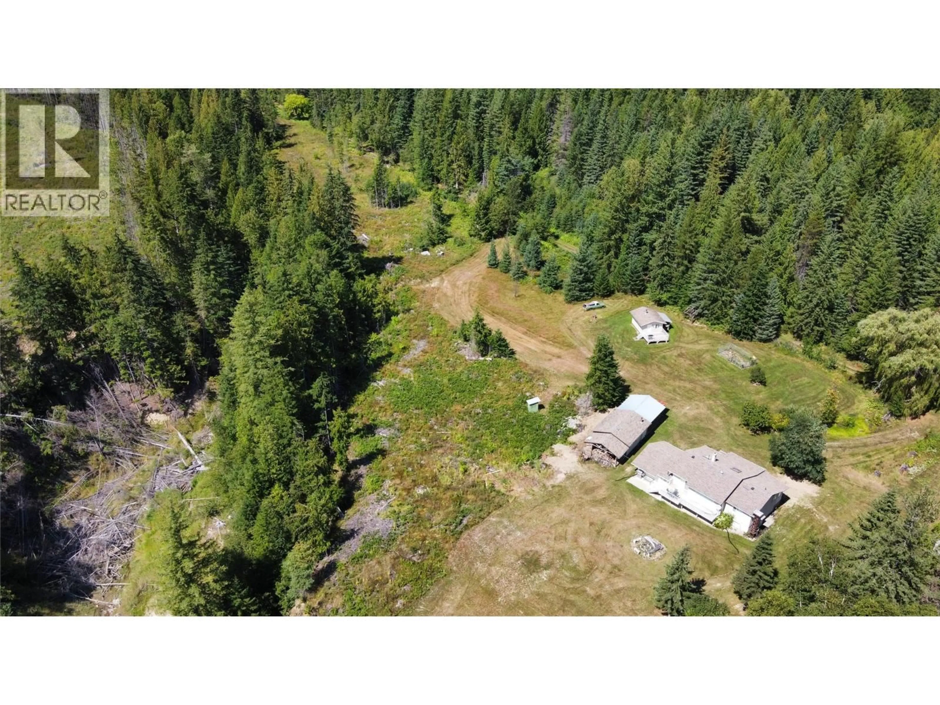 A pic from outside/outdoor area/front of a property/back of a property/a pic from drone, forest/trees view for 145 MOSTYN ROAD, Arrow Park British Columbia V0G1R1