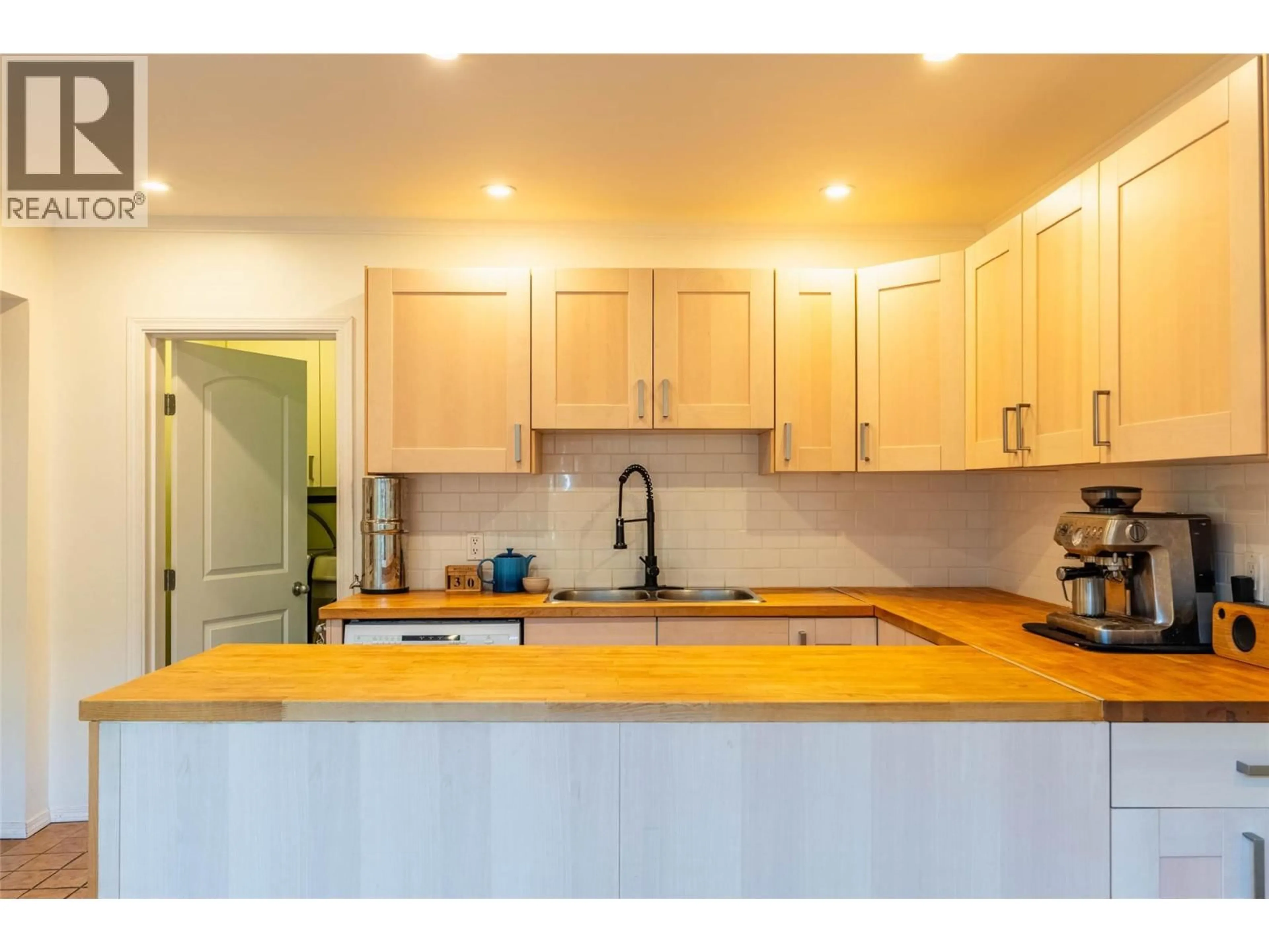 Open concept kitchen, wood/laminate floor for 314 THIRD STREET, Nelson British Columbia V1L2P3