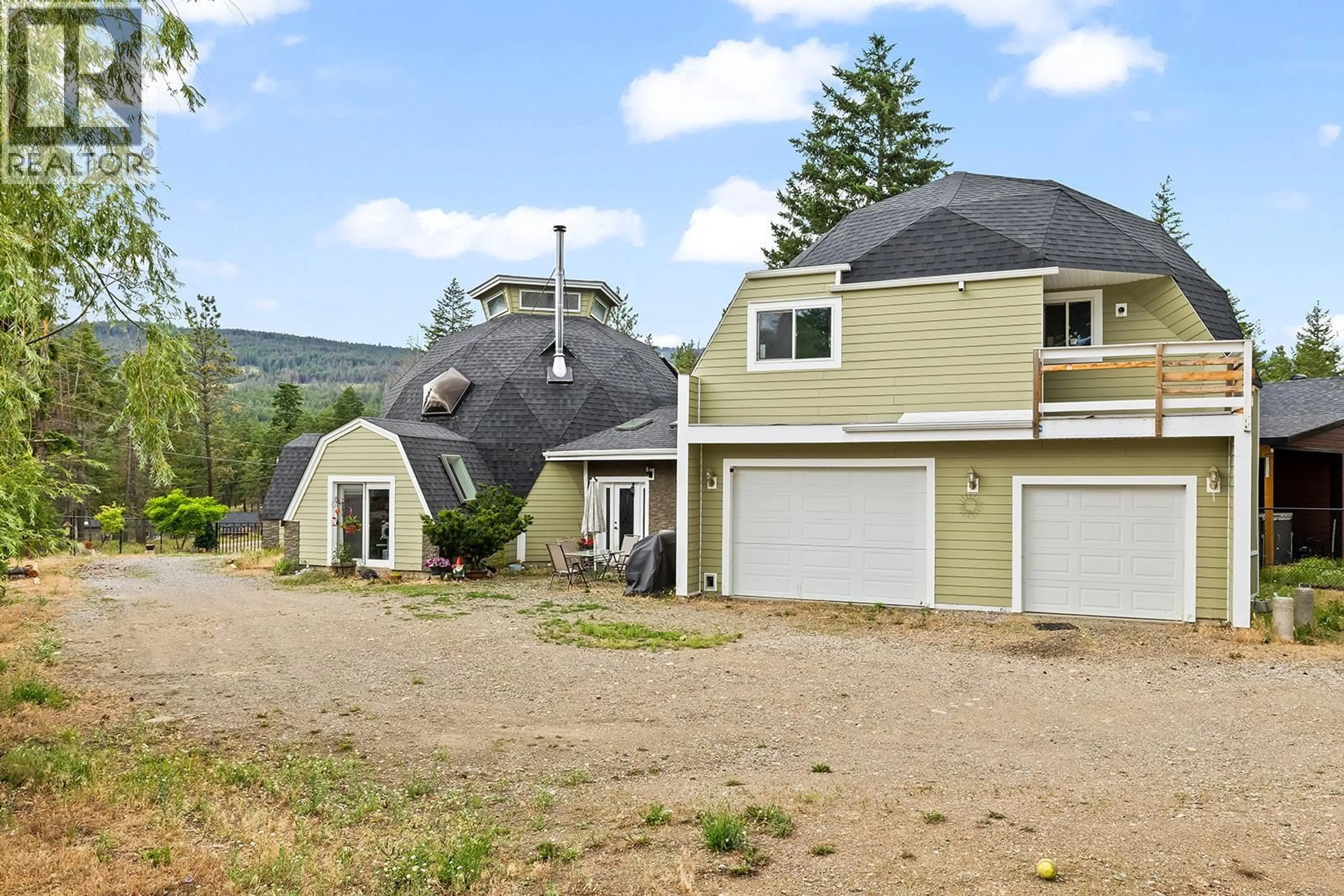 A pic from outside/outdoor area/front of a property/back of a property/a pic from drone, mountain view for 7172 DUNWATERS ROAD, Kelowna British Columbia V1Z3W5