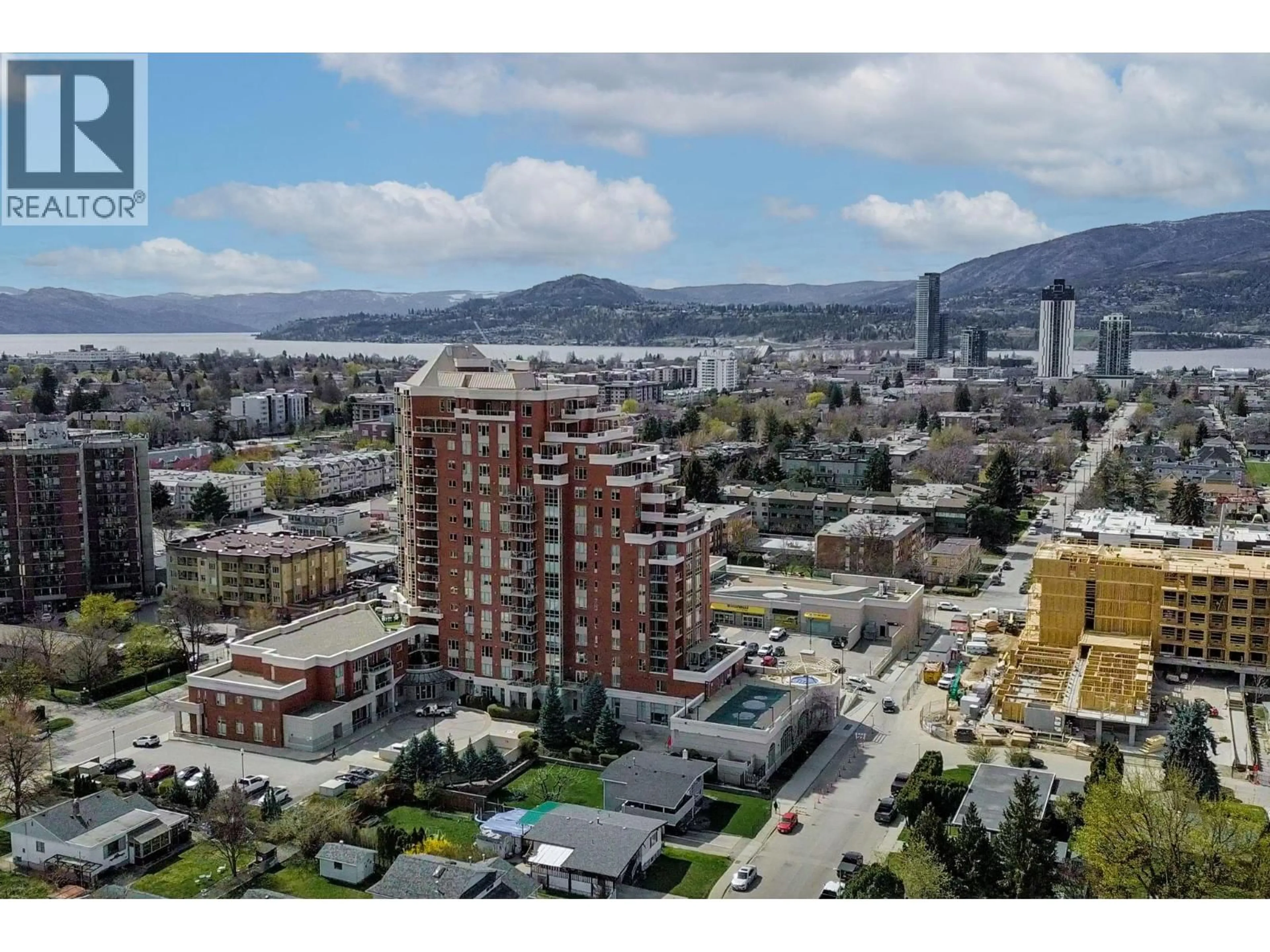 A pic from outside/outdoor area/front of a property/back of a property/a pic from drone, mountain view for 205 - 1160 BERNARD AVENUE, Kelowna British Columbia V1Y6R2