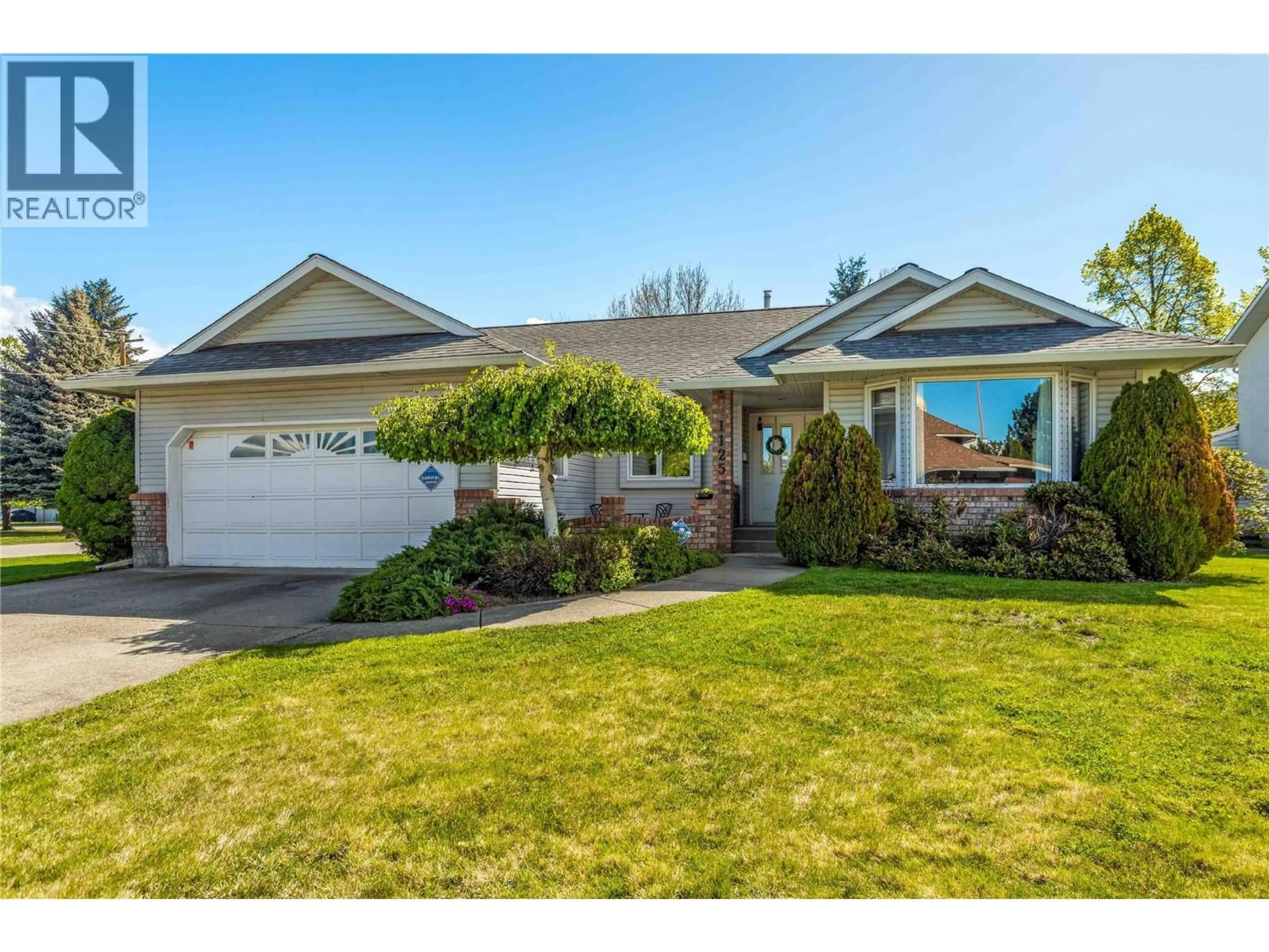 Home with vinyl exterior material, street for 1125 KEYES ROAD, Kelowna British Columbia V1X7B2