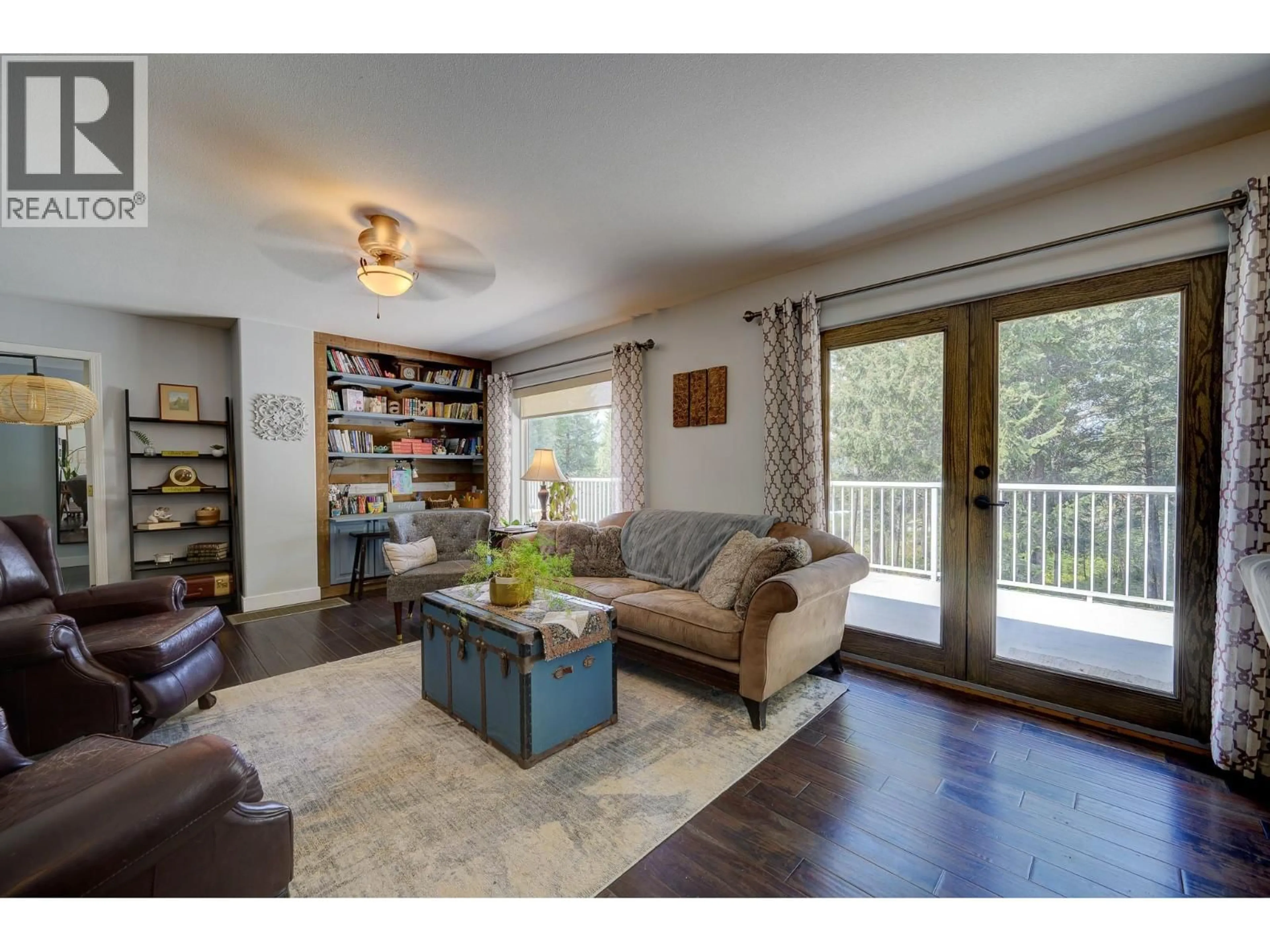 Living room with furniture, wood/laminate floor for 2959 PIVA ROAD, Kamloops British Columbia V0E3E0