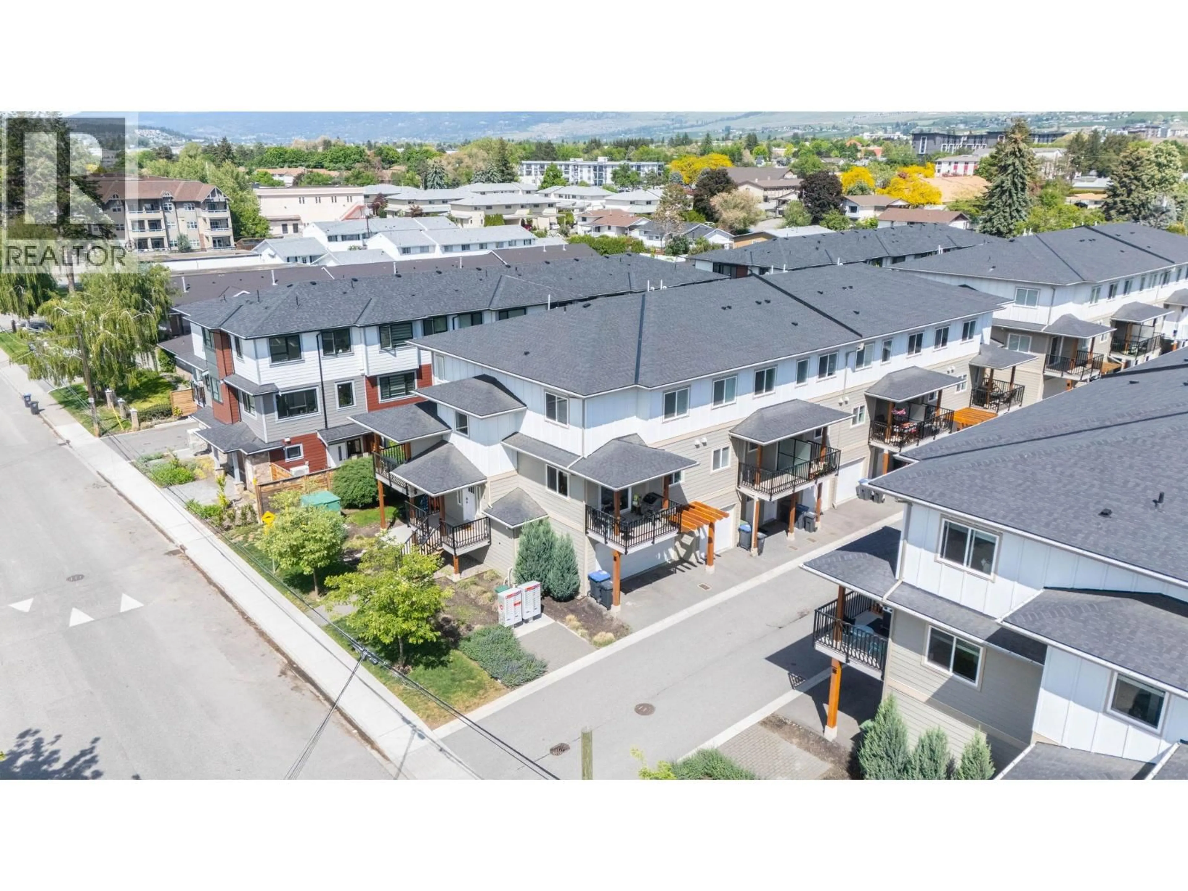A pic from outside/outdoor area/front of a property/back of a property/a pic from drone, mountain view for 1 - 255 TAYLOR ROAD, Kelowna British Columbia V1X4G1