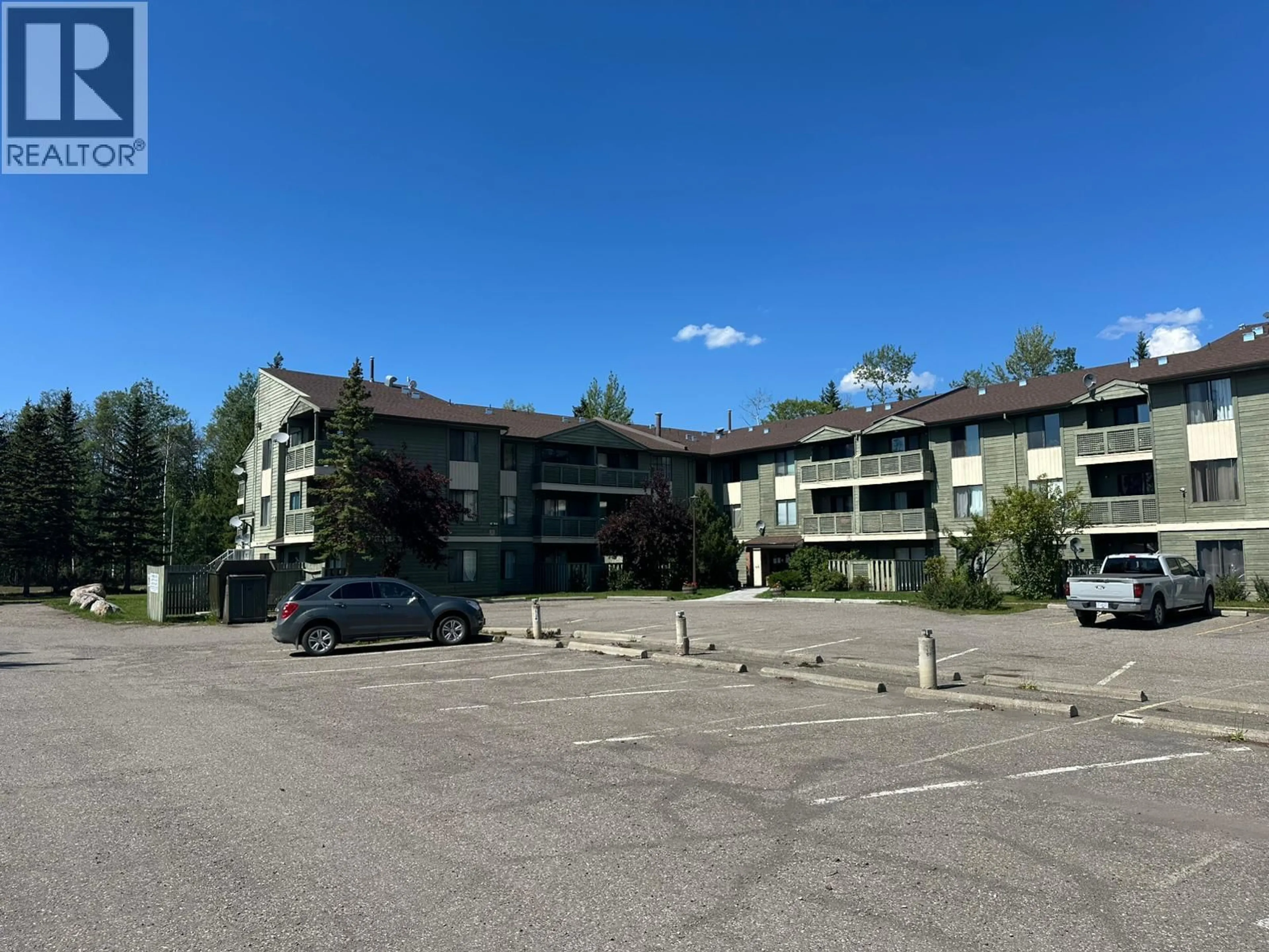 A pic from outside/outdoor area/front of a property/back of a property/a pic from drone, unknown for 201 - 185 CHAMBERLAIN CRESCENT, Tumbler Ridge British Columbia V0C2W0