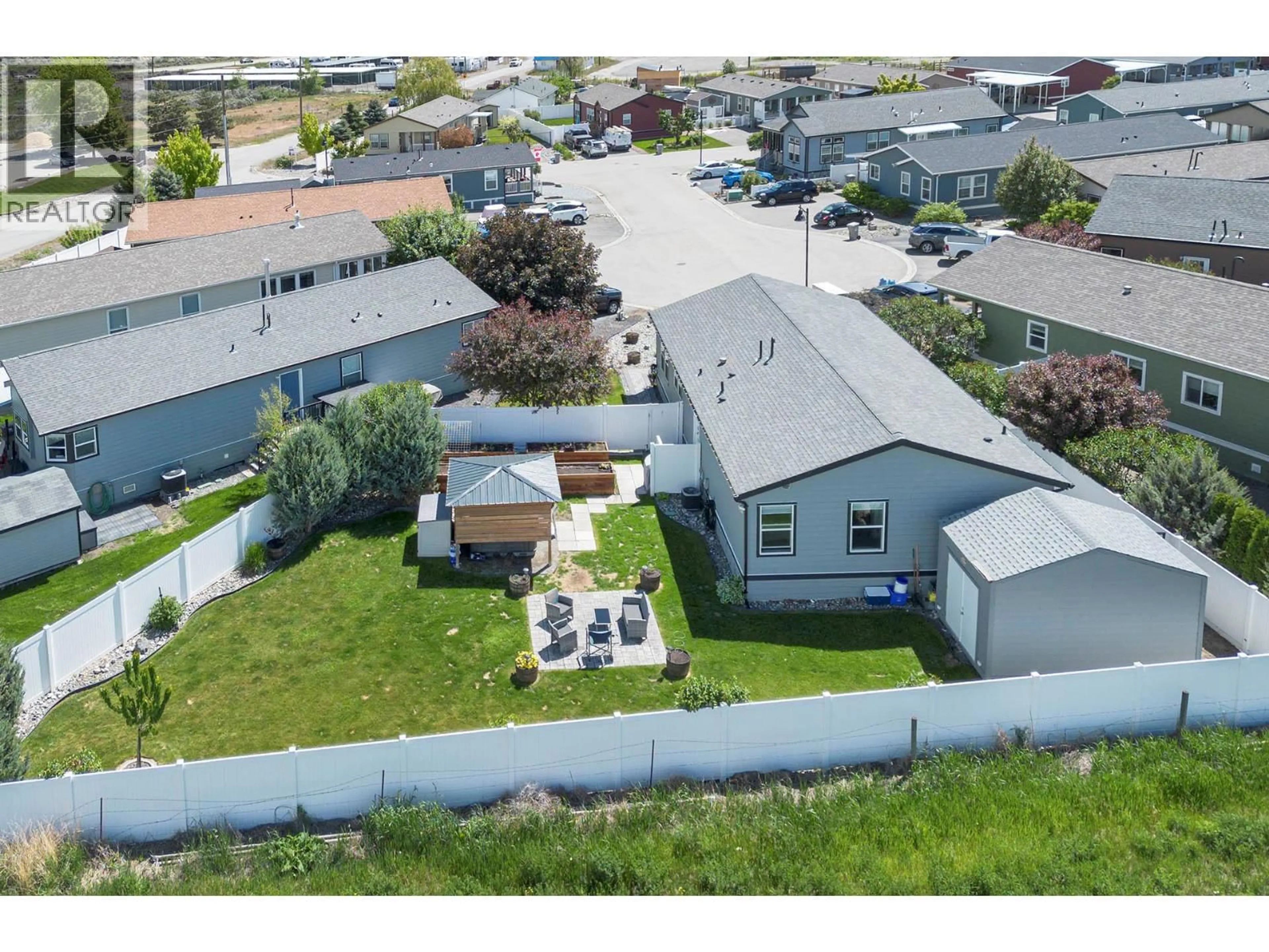 A pic from outside/outdoor area/front of a property/back of a property/a pic from drone, street for 5 - 1030 RICARDO ROAD, Kamloops British Columbia V2H0C7