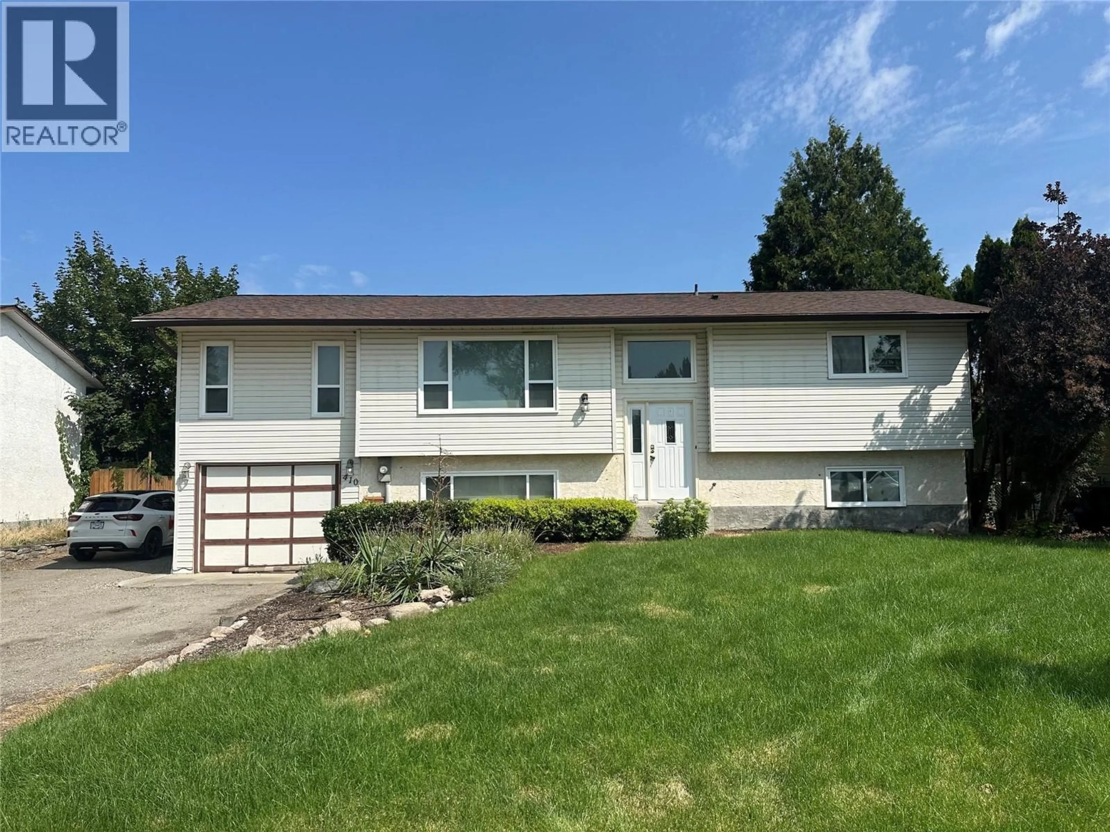 Home with vinyl exterior material, street for 410 HILLABY AVENUE, Kelowna British Columbia V1X6G2