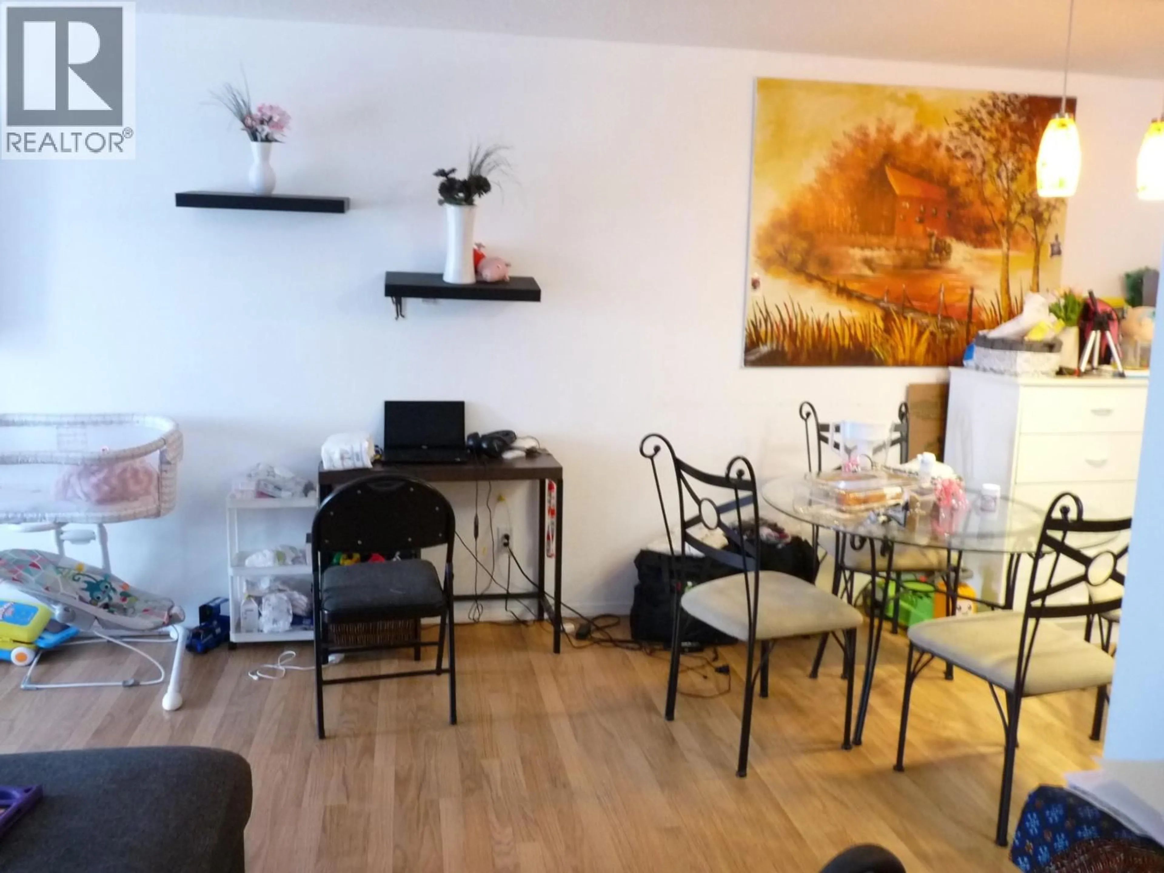 Living room with furniture, wood/laminate floor for 309 - 555 DALGLEISH DRIVE, Kamloops British Columbia V2C6C7