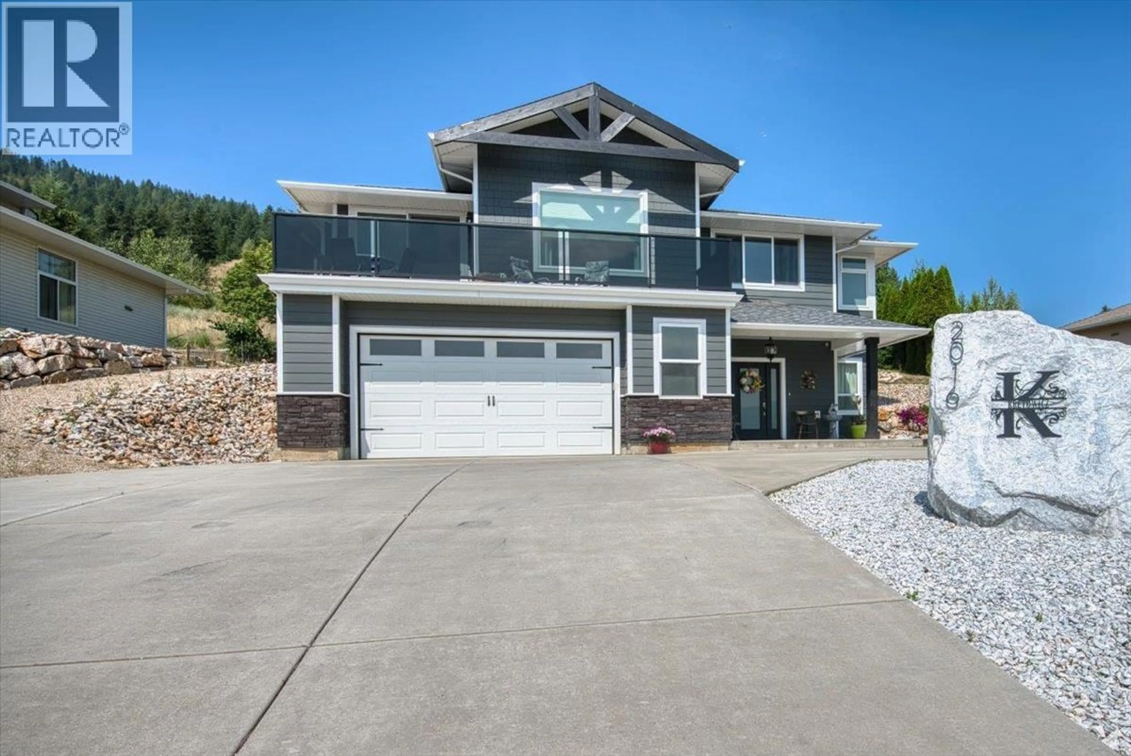Home with vinyl exterior material, street for 2016 MOUNTAIN VIEW AVENUE, Lumby British Columbia V0E2G0