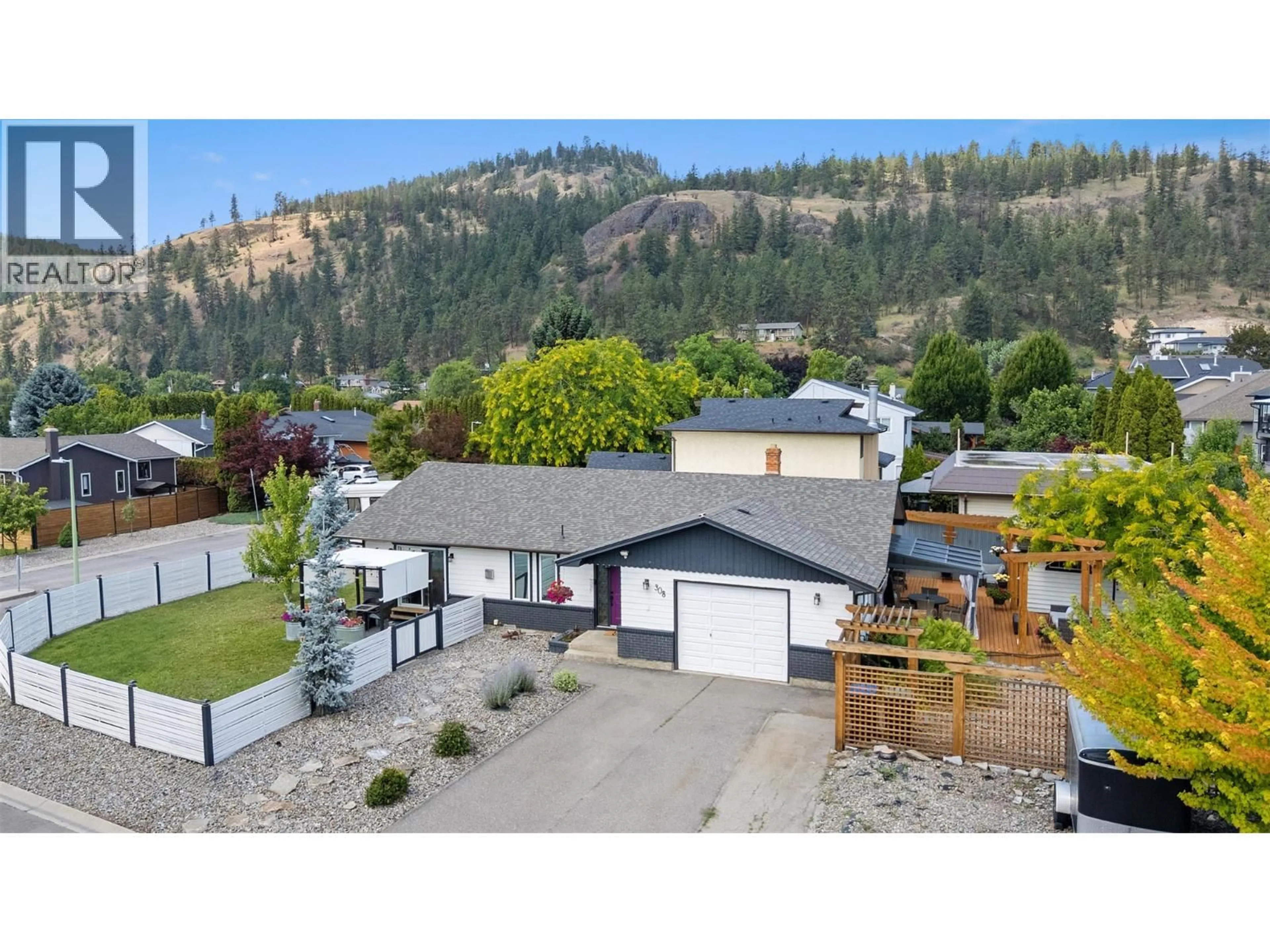 A pic from outside/outdoor area/front of a property/back of a property/a pic from drone, mountain view for 308 MCTAVISH ROAD, Kelowna British Columbia V1V1P2