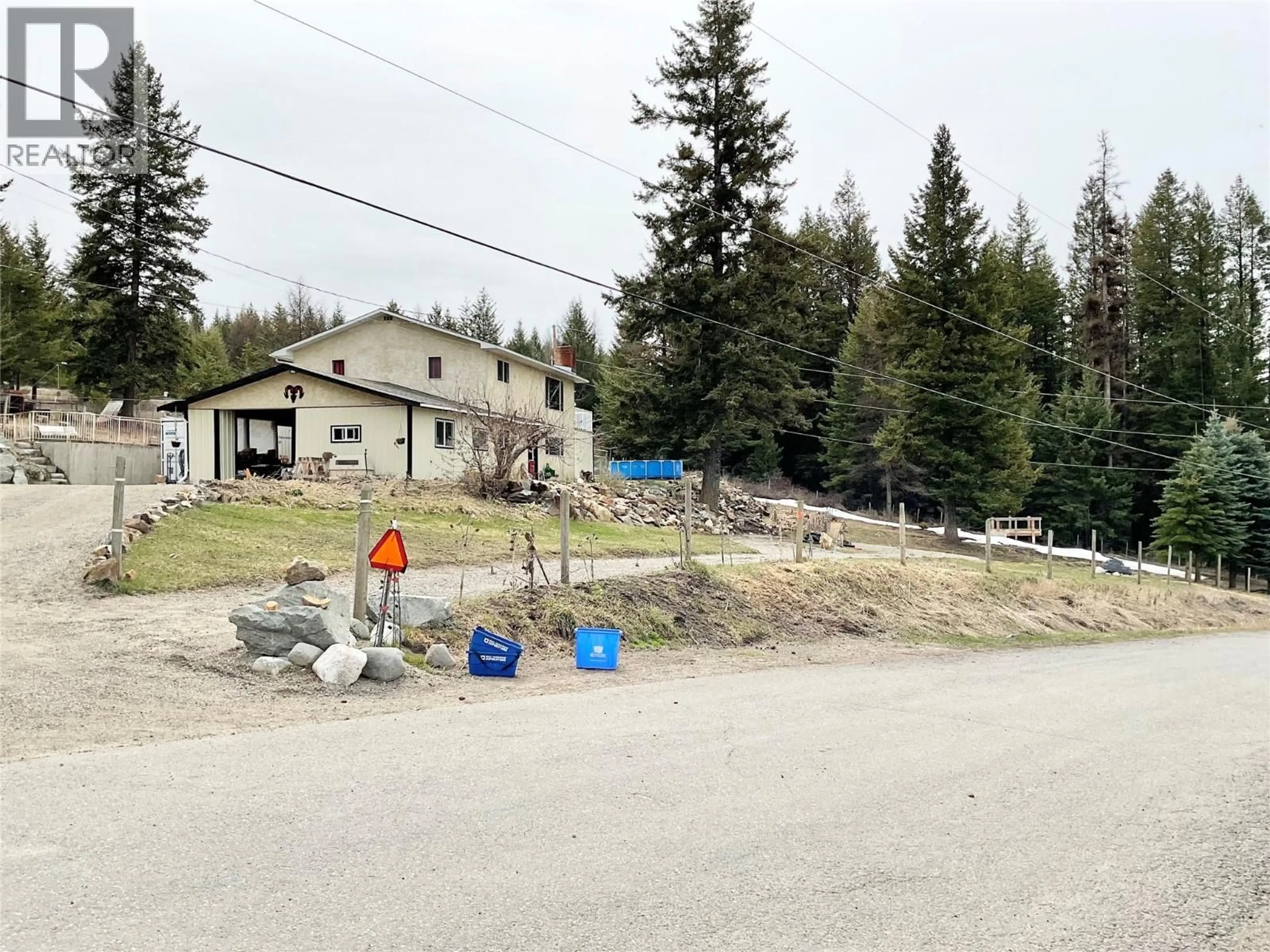 A pic from outside/outdoor area/front of a property/back of a property/a pic from drone, mountain view for 1414 KELLY ROAD, Bridesville British Columbia V0H1B0