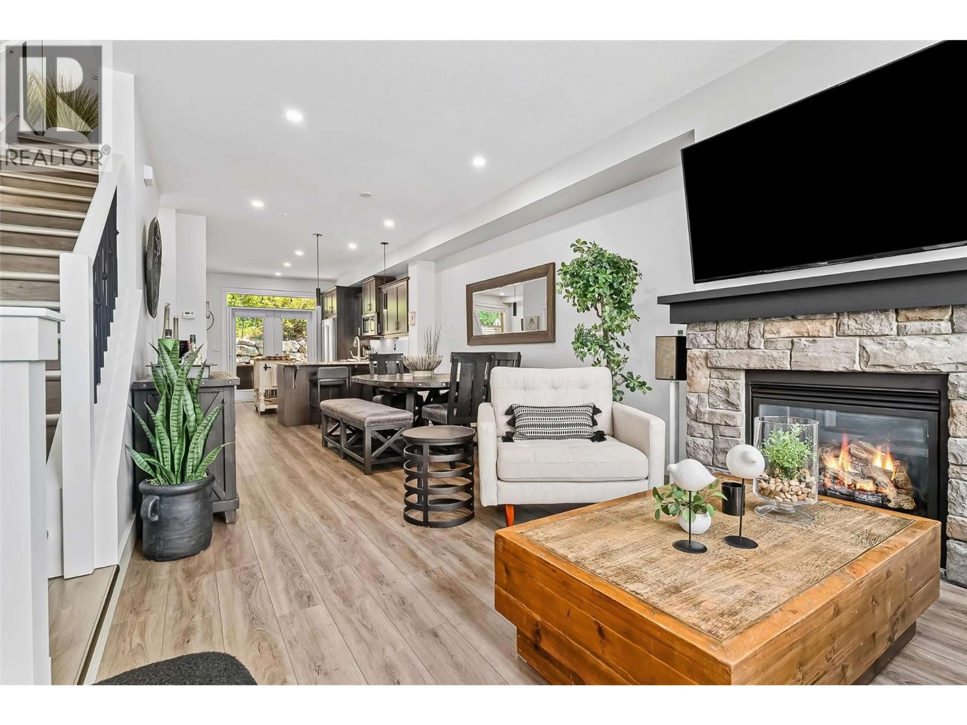 Living room with furniture, wood/laminate floor for 28 - 333 LONGSPOON DRIVE, Vernon British Columbia V1H2L1