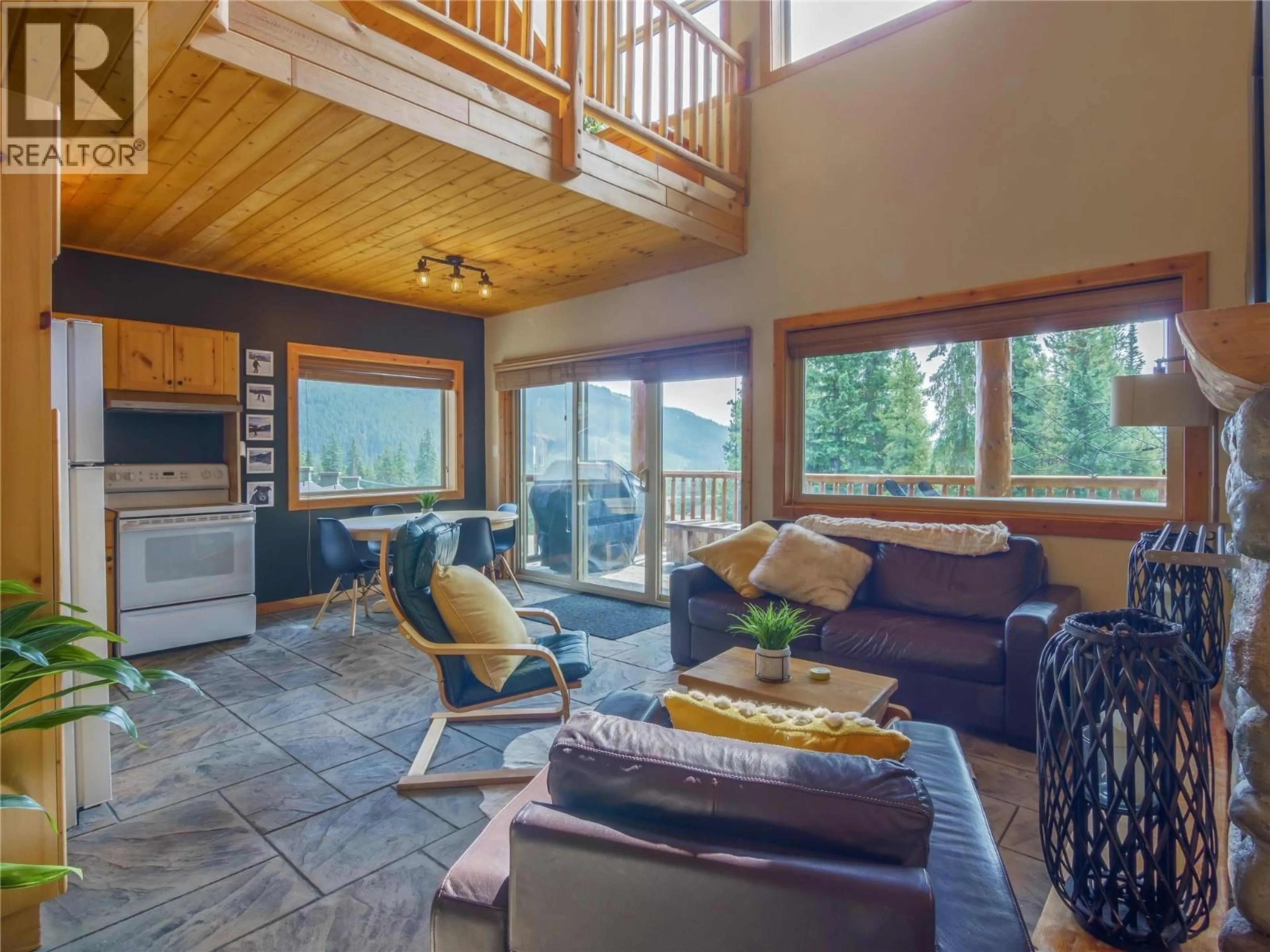 Living room with furniture, wood/laminate floor for 301 - 1271 APEX MOUNTAIN ROAD, Apex Mountain British Columbia V2A0E2