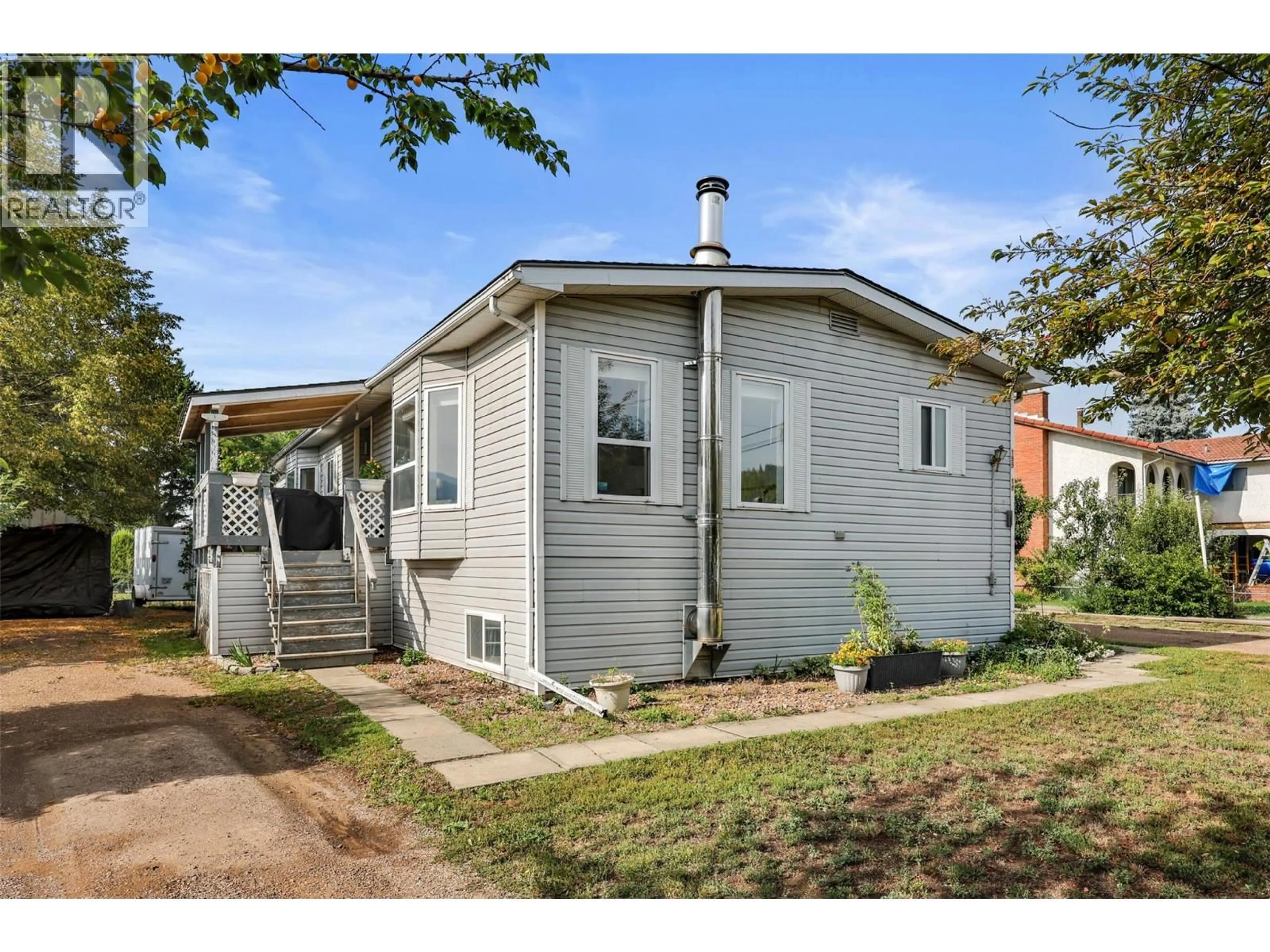 Home with vinyl exterior material, street for 18 - 159 ZIRNHELT ROAD, Kamloops British Columbia V2H0B3