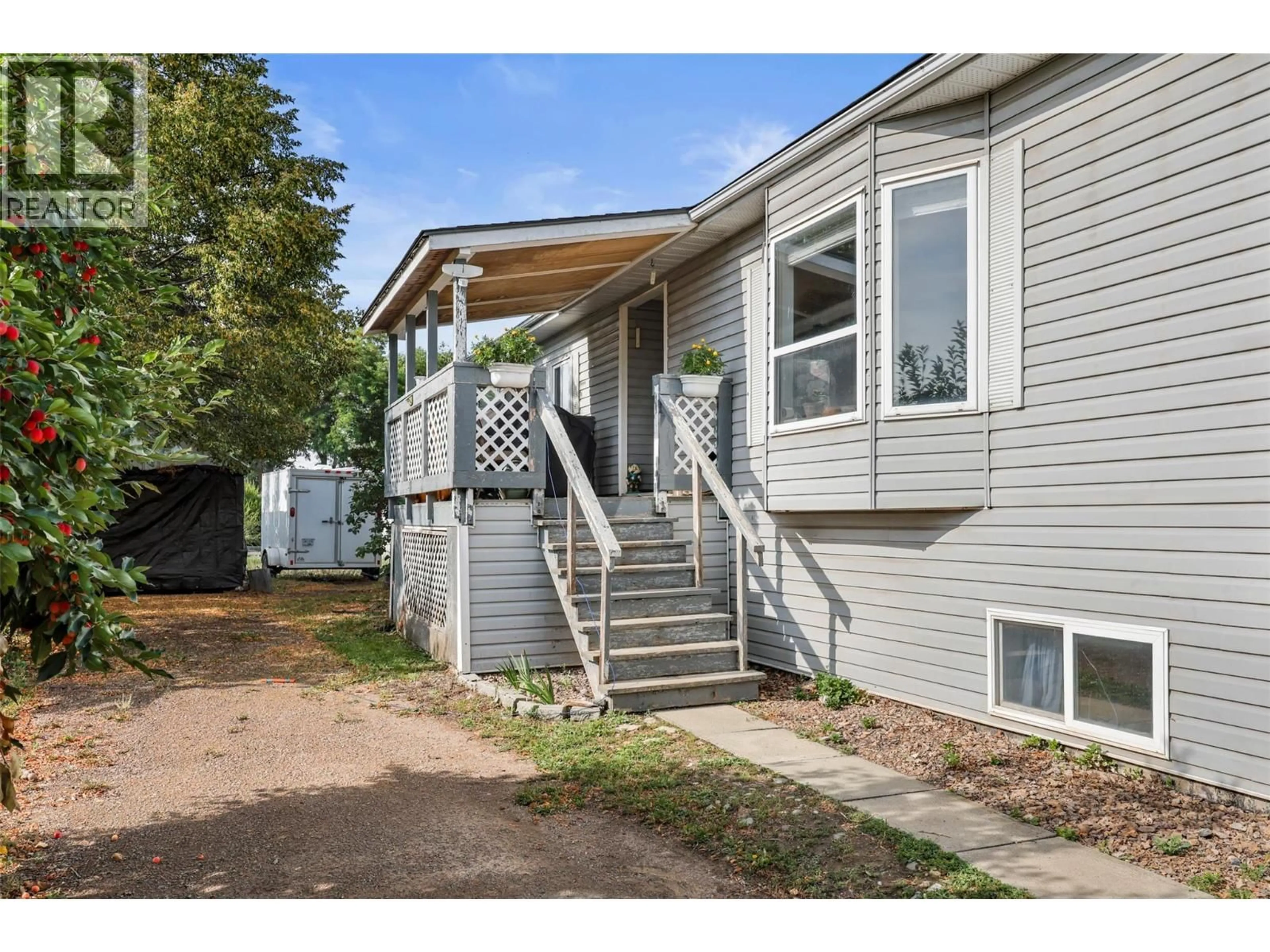 Home with vinyl exterior material, street for 18 - 159 ZIRNHELT ROAD, Kamloops British Columbia V2H0B3