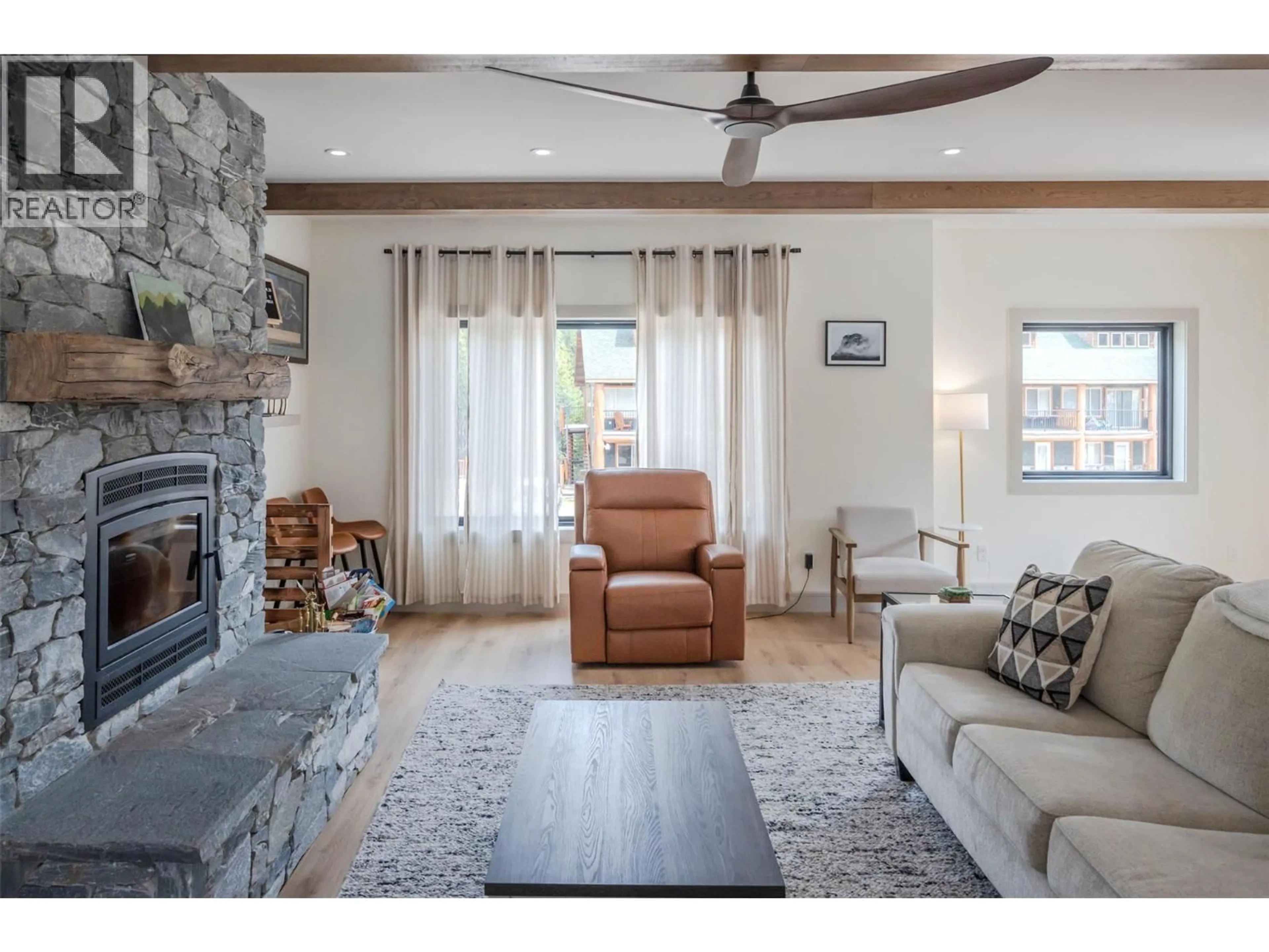 Living room with furniture, wood/laminate floor for SL1 - 144 CLEARVIEW CRESCENT, Penticton British Columbia V0X1K0