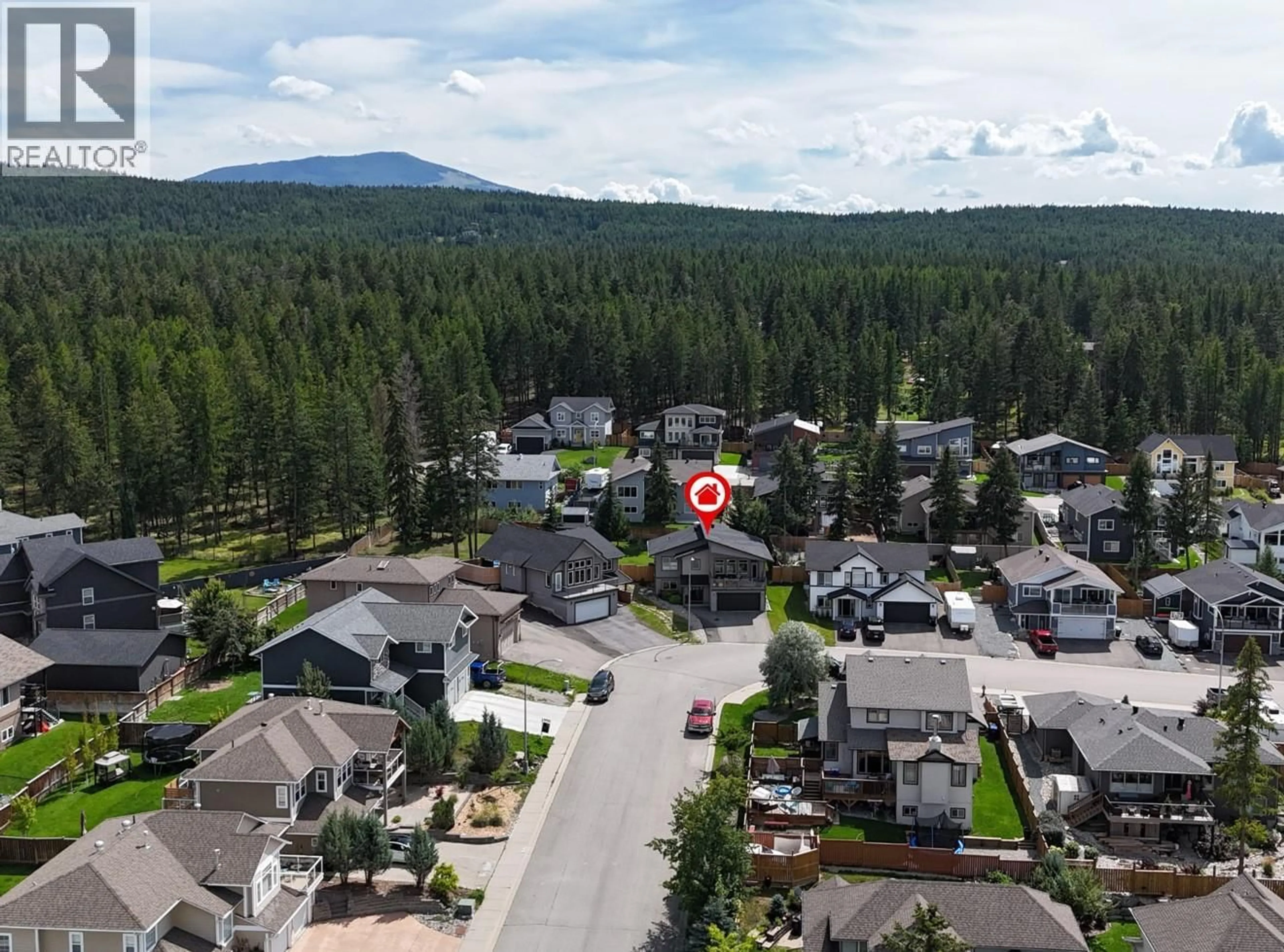 A pic from outside/outdoor area/front of a property/back of a property/a pic from drone, mountain view for 201 18 STREET SOUTH, Cranbrook British Columbia V1C0E1