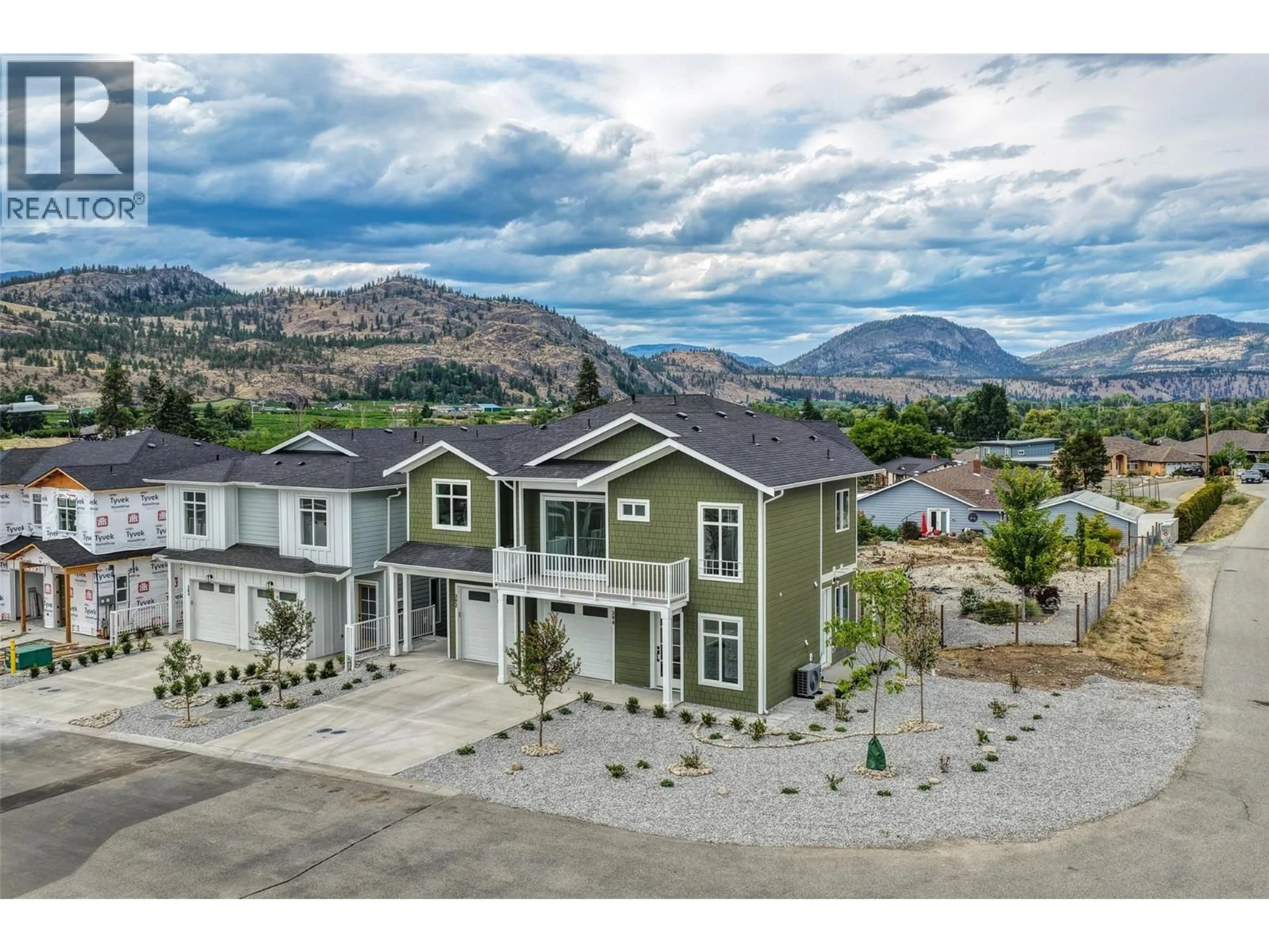 A pic from outside/outdoor area/front of a property/back of a property/a pic from drone, mountain view for 392 CHARDONNAY AVENUE, Oliver British Columbia V0H1T4
